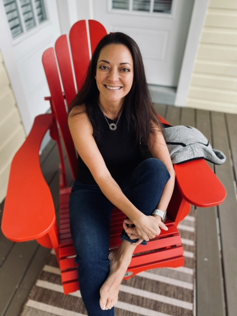 portrait of author sitting in a chair