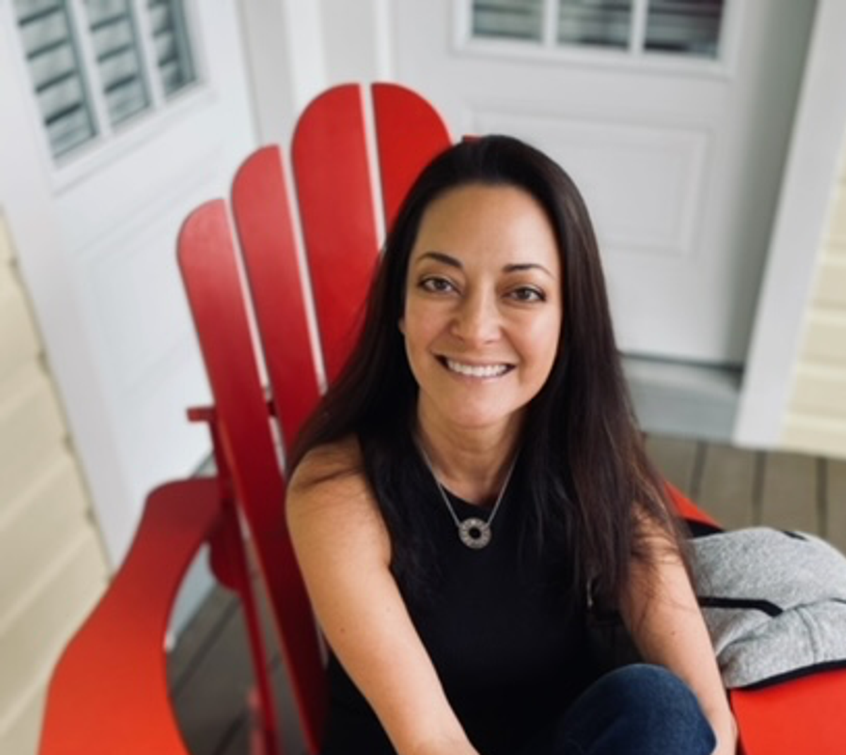 portrait of author sitting in a chair