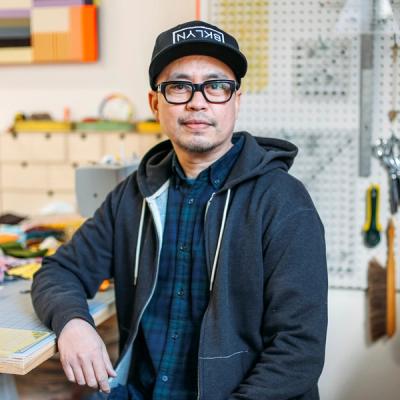A photo of Paolo Arao in a workshop. 