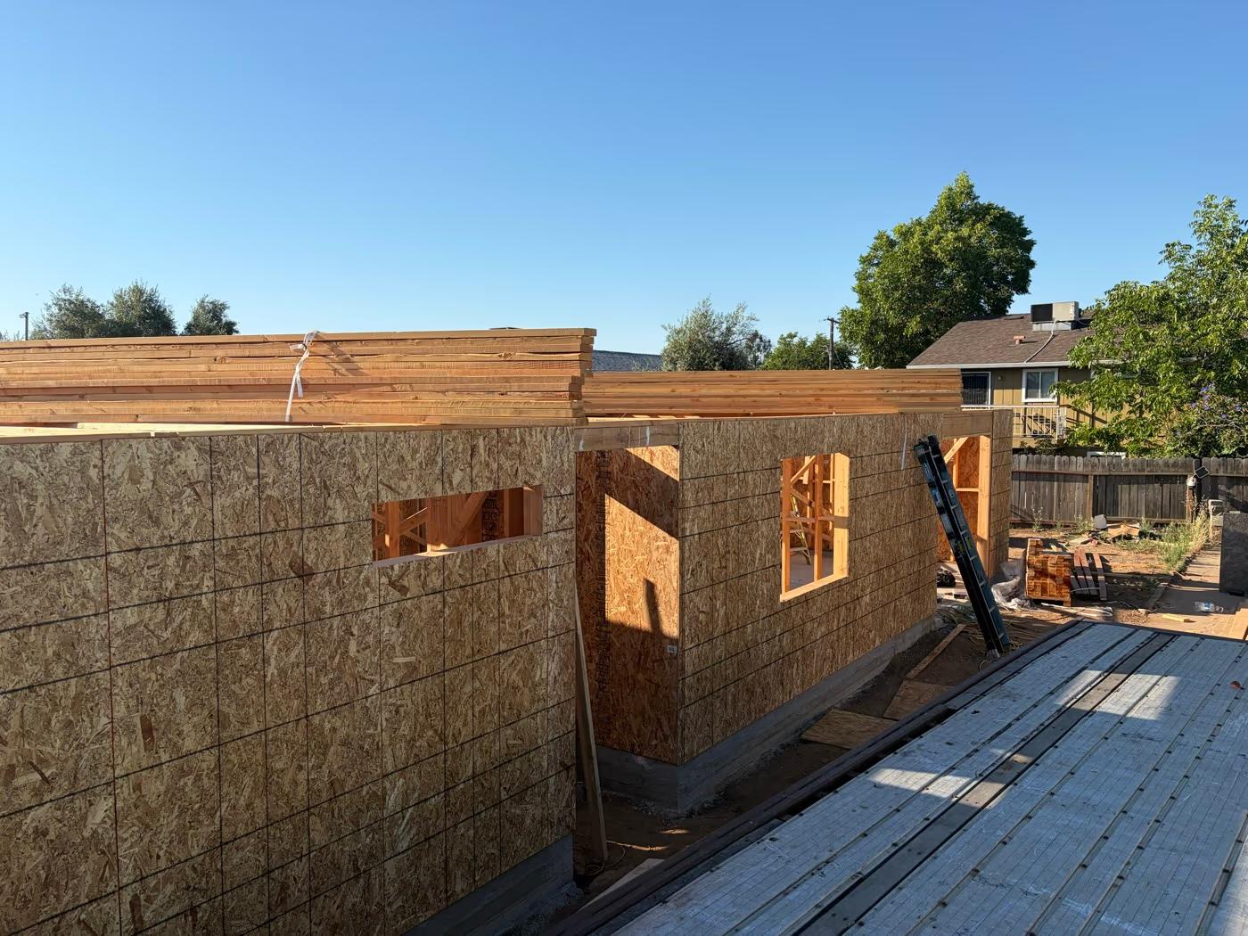 Roof trusses staged on the completed walls