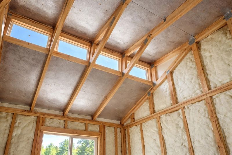 Completed vaulted ceiling remodel with exposed scissor trusses, spray foam insulation, and clerestory skylights installed by Mike Walker Lumber Co Inc