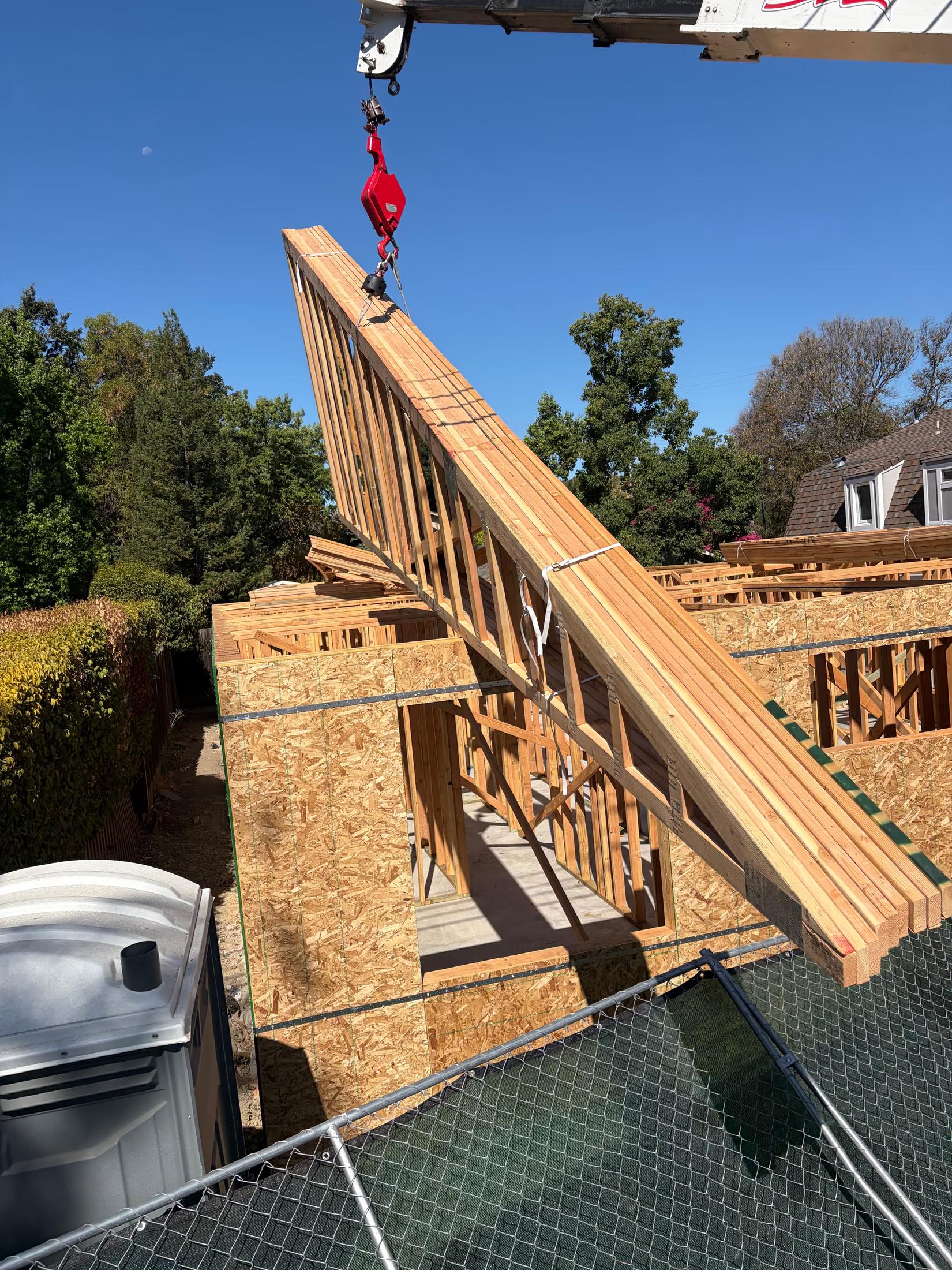 Truss bundle lifted onto the walls