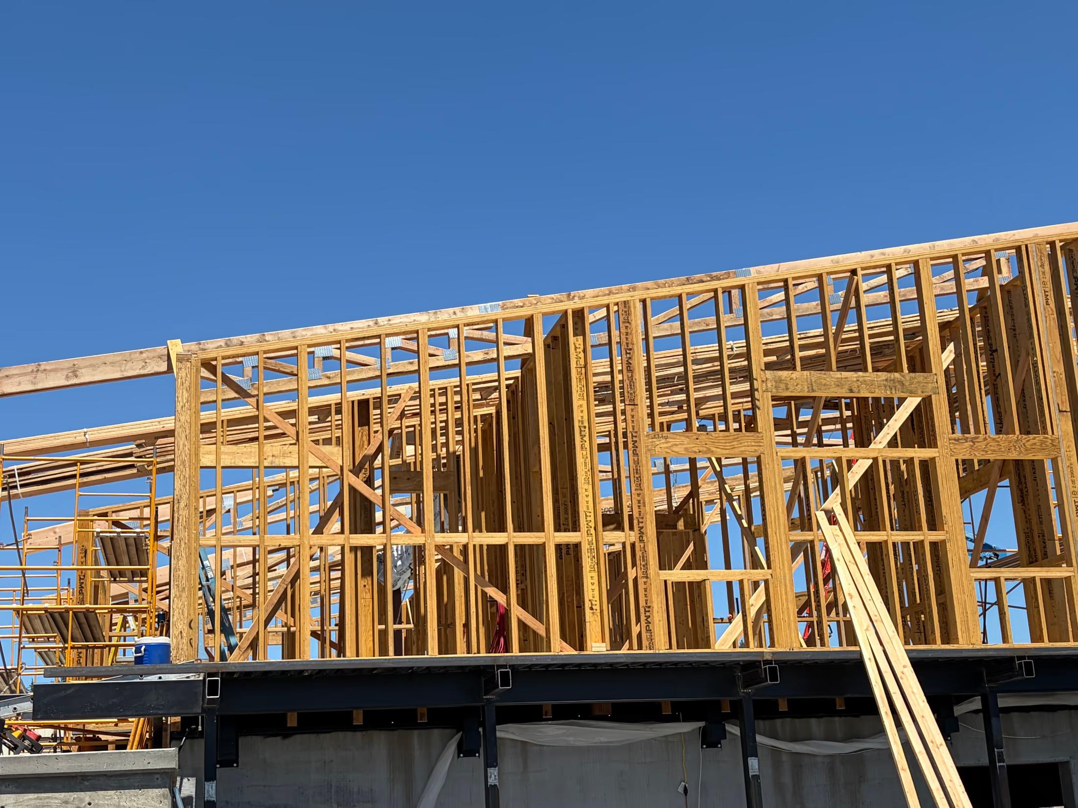 Wall framing over the steel podium