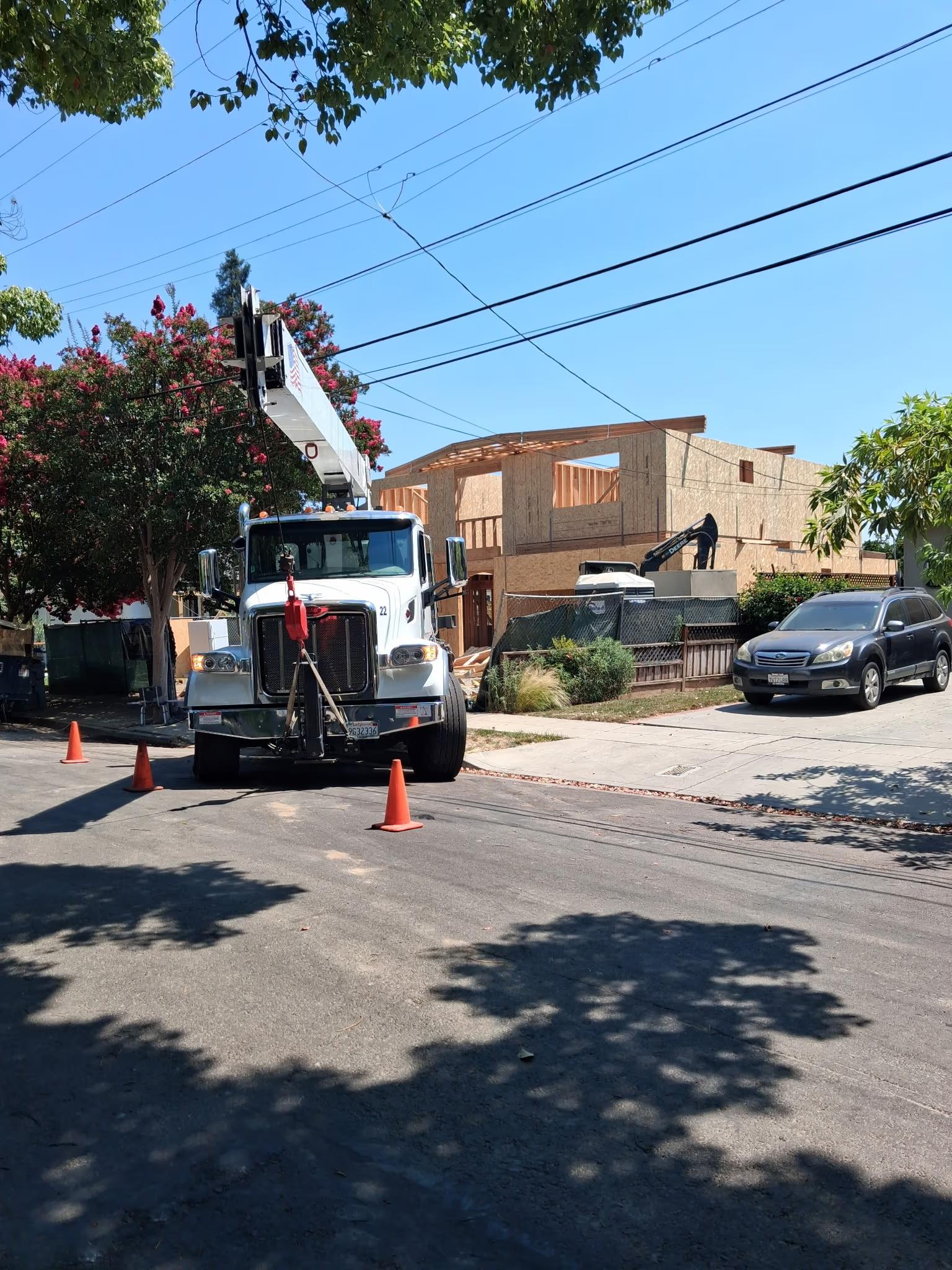 Crane set up on the street for the roof package
