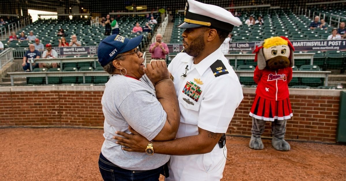 Navy Chief Alyssa Edwards surprised her 8-year-old son Austin at home plate during an All-Star baseball game in Chesapeake, Virginia, after a three-month deployment.