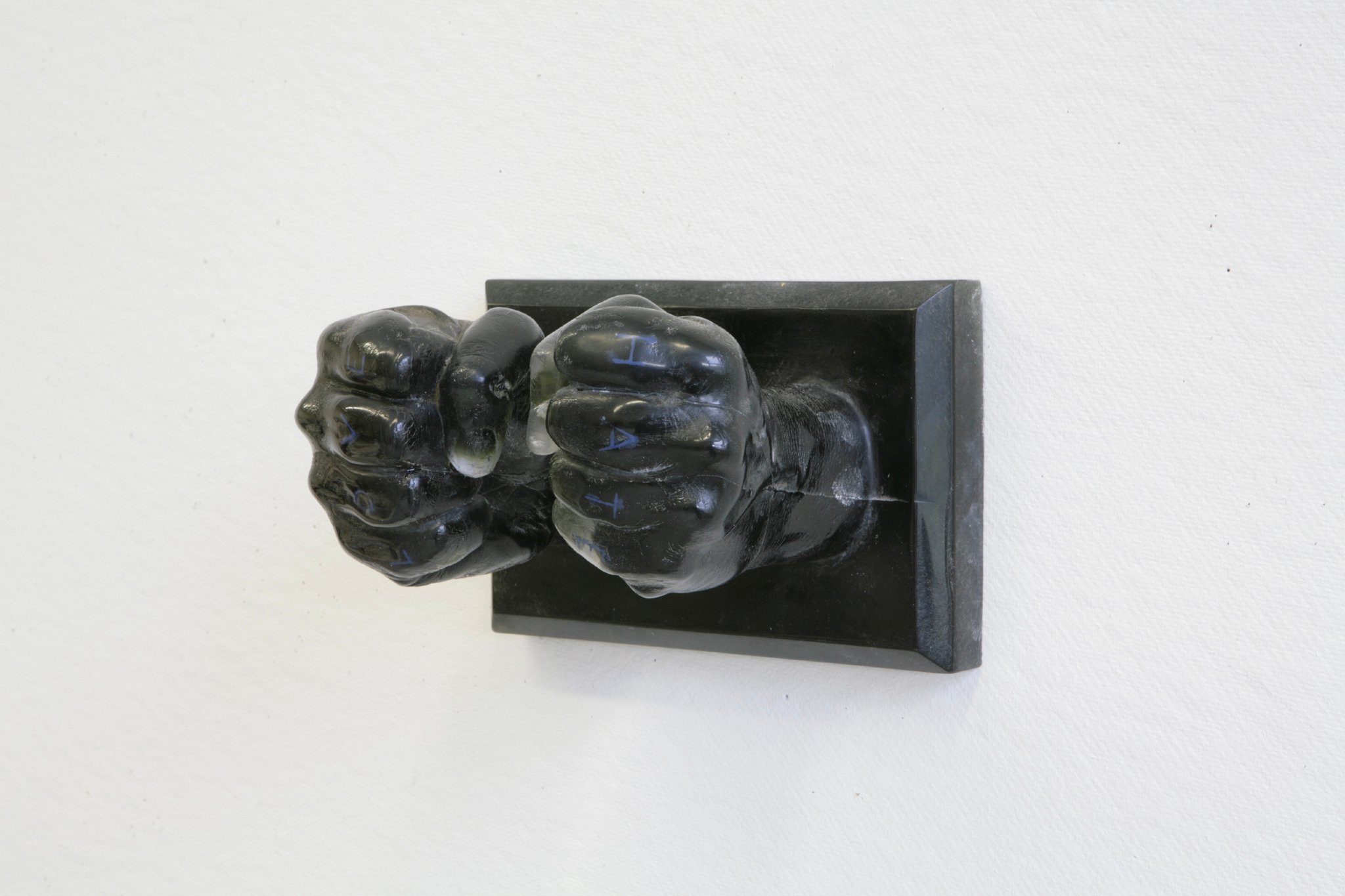 Sculpture of two fists in black