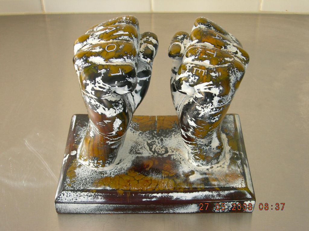 Sculpture of two fists in yellow