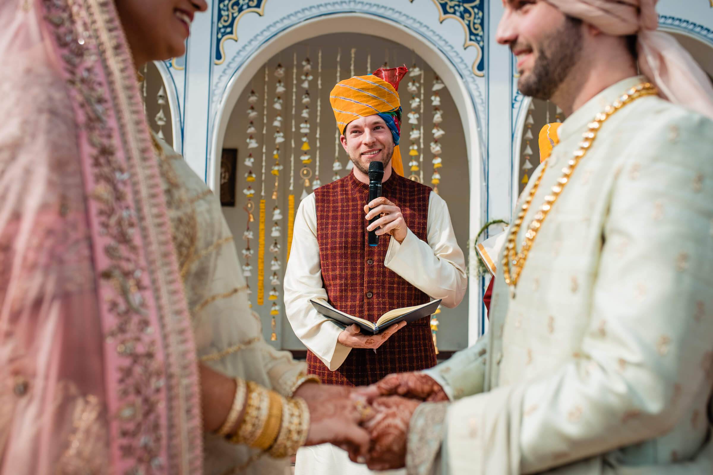 Maitrayee and Eric exchange vows during traditional ceremony in ornate Rajasthan venue with officiant