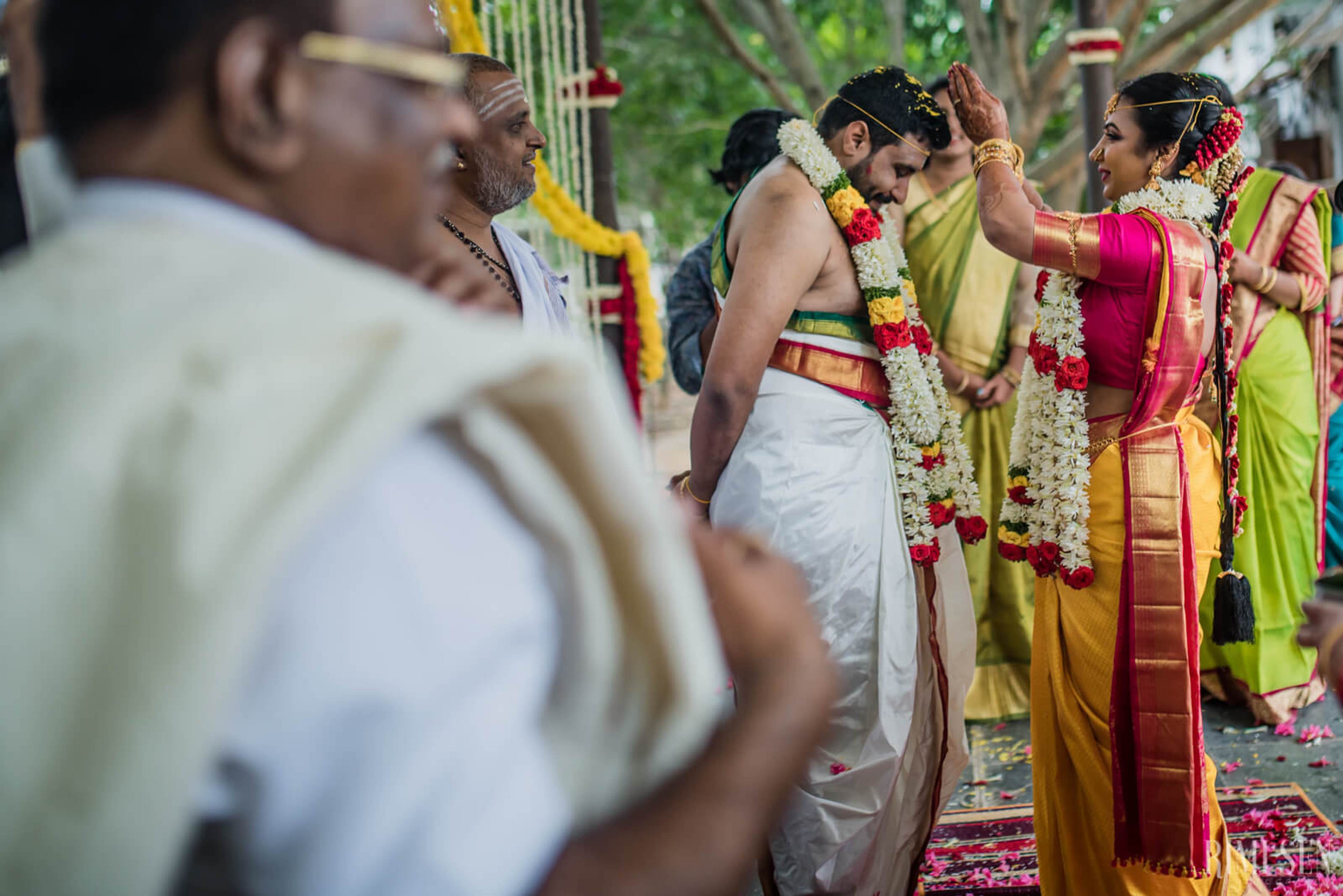 Nivetha & Sridhar exchange flower garlands during traditional South Indian wedding ceremony in Bangalore