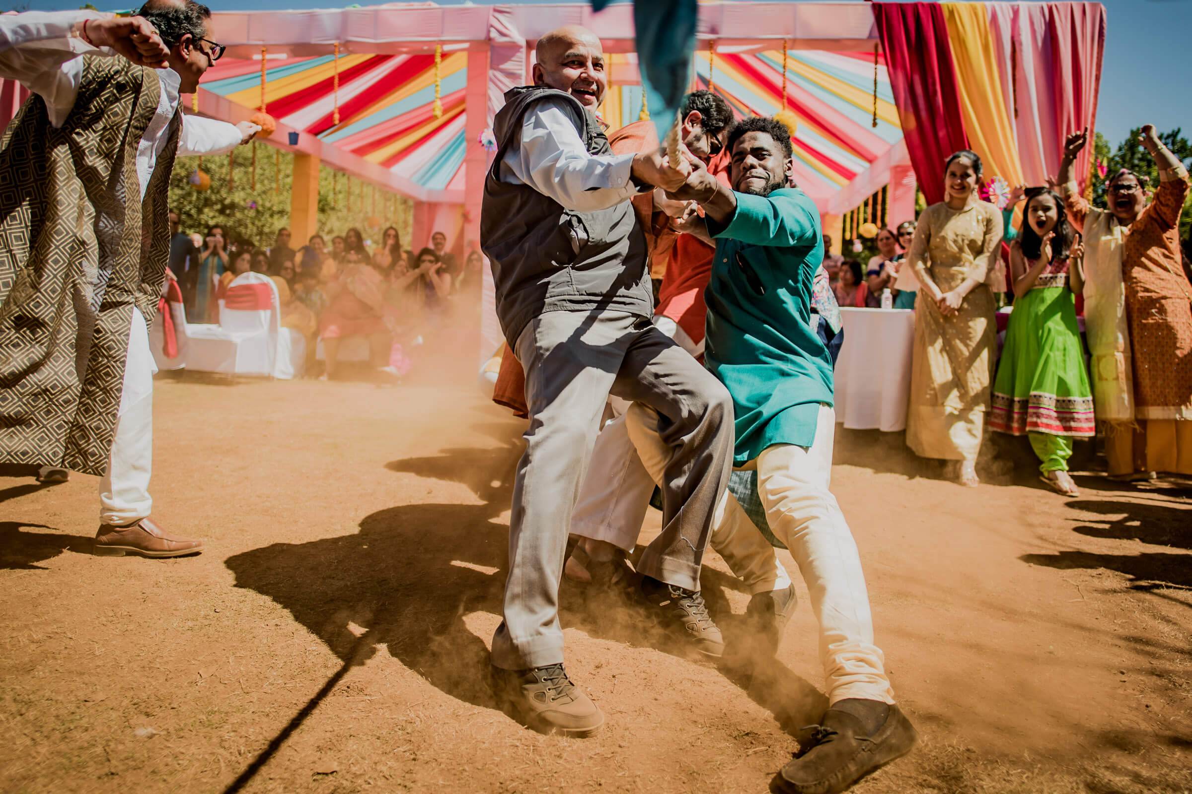 Shreya and Yash dancing in dust at colorful Mahabaleshwar wedding celebration with guests