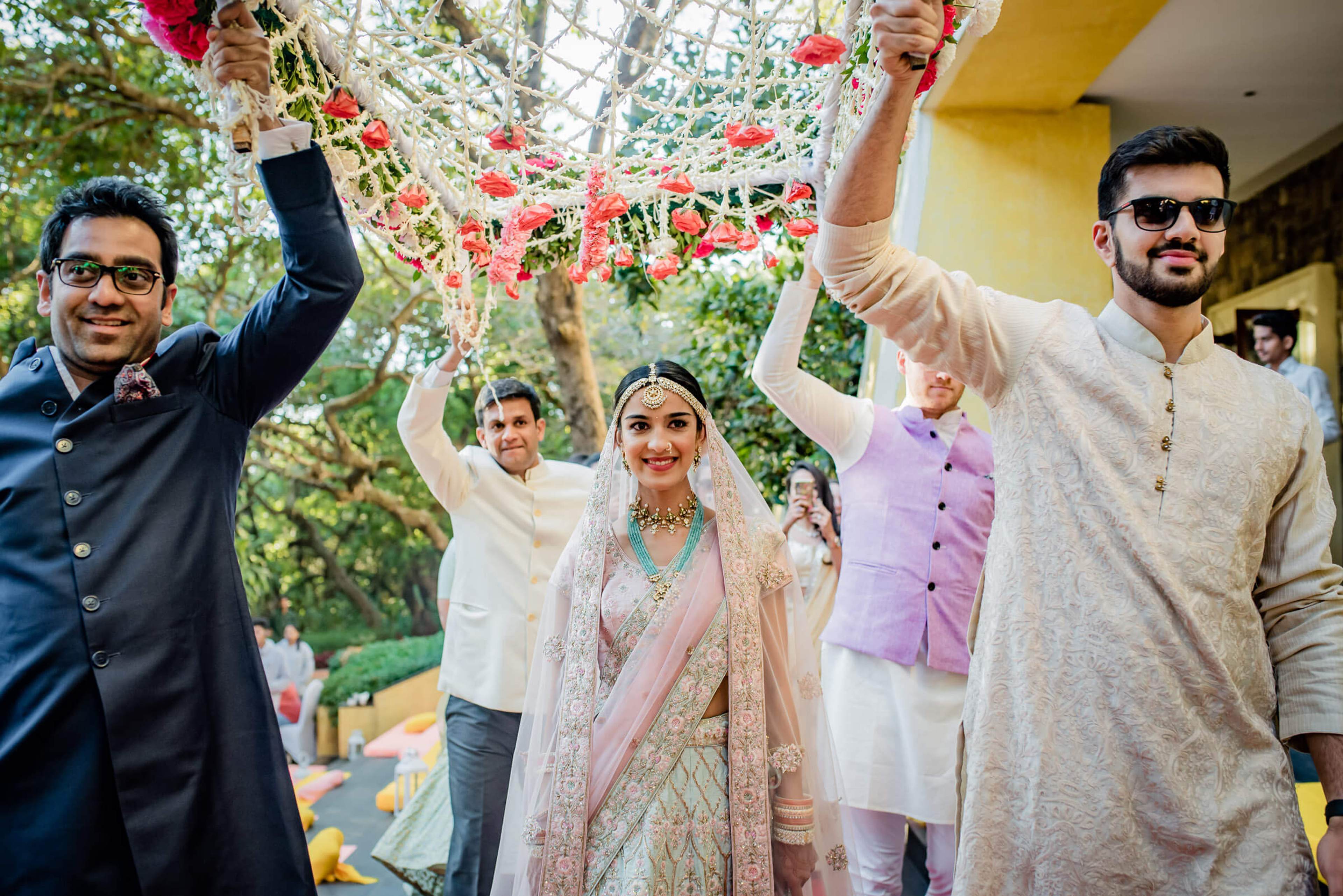 Shreya and Yash celebrate under a floral canopy with joyful family at Mahabaleshwar wedding