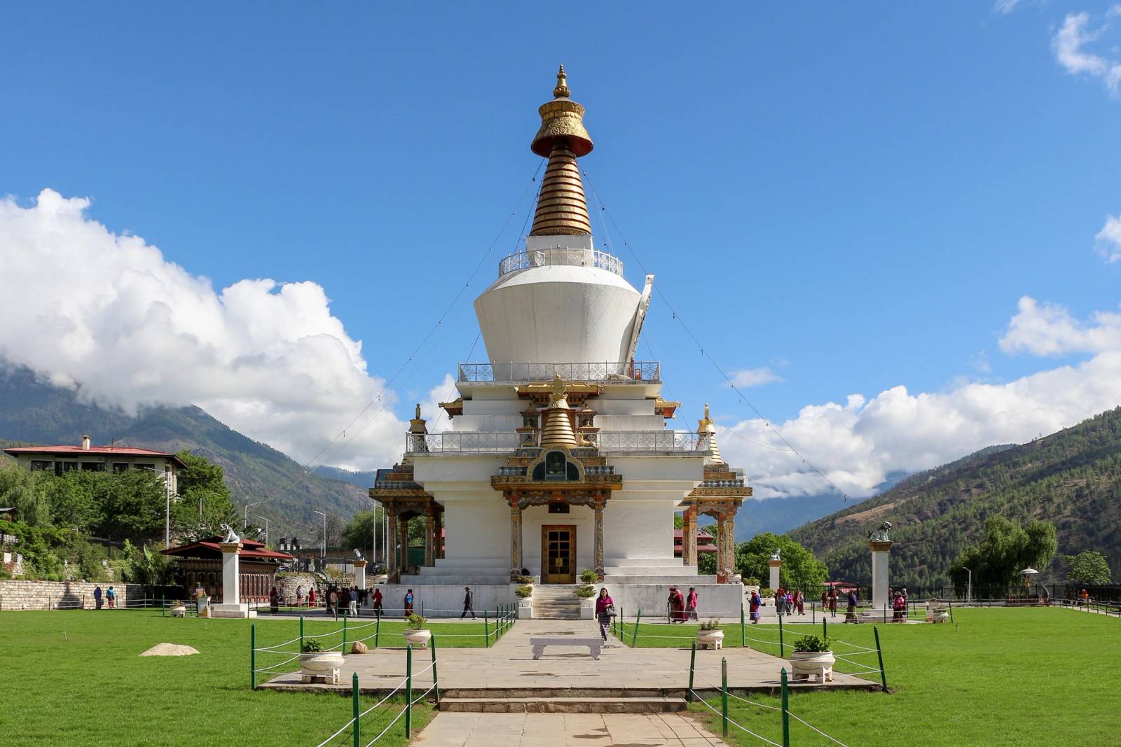 The white National Memorial Chorten with its gold spire, seen across its lawn in Thimphu