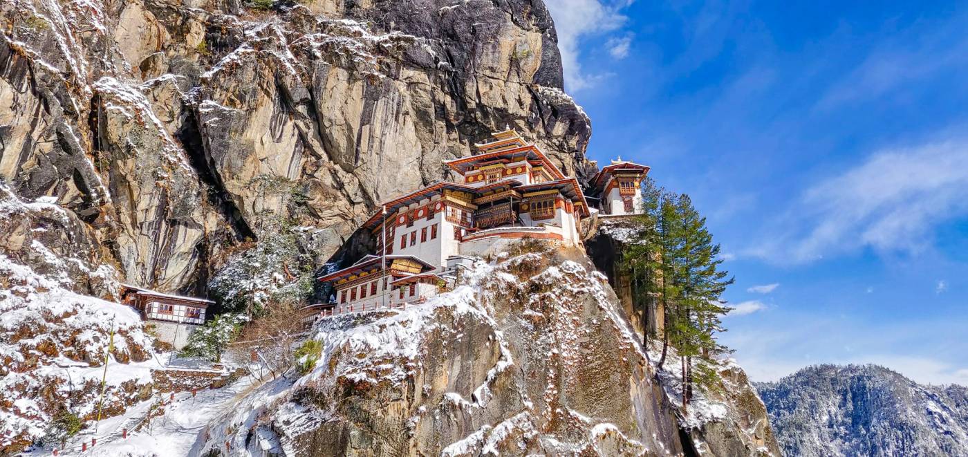 Tiger's Nest Monastery on its granite cliff, dusted with fresh snow
