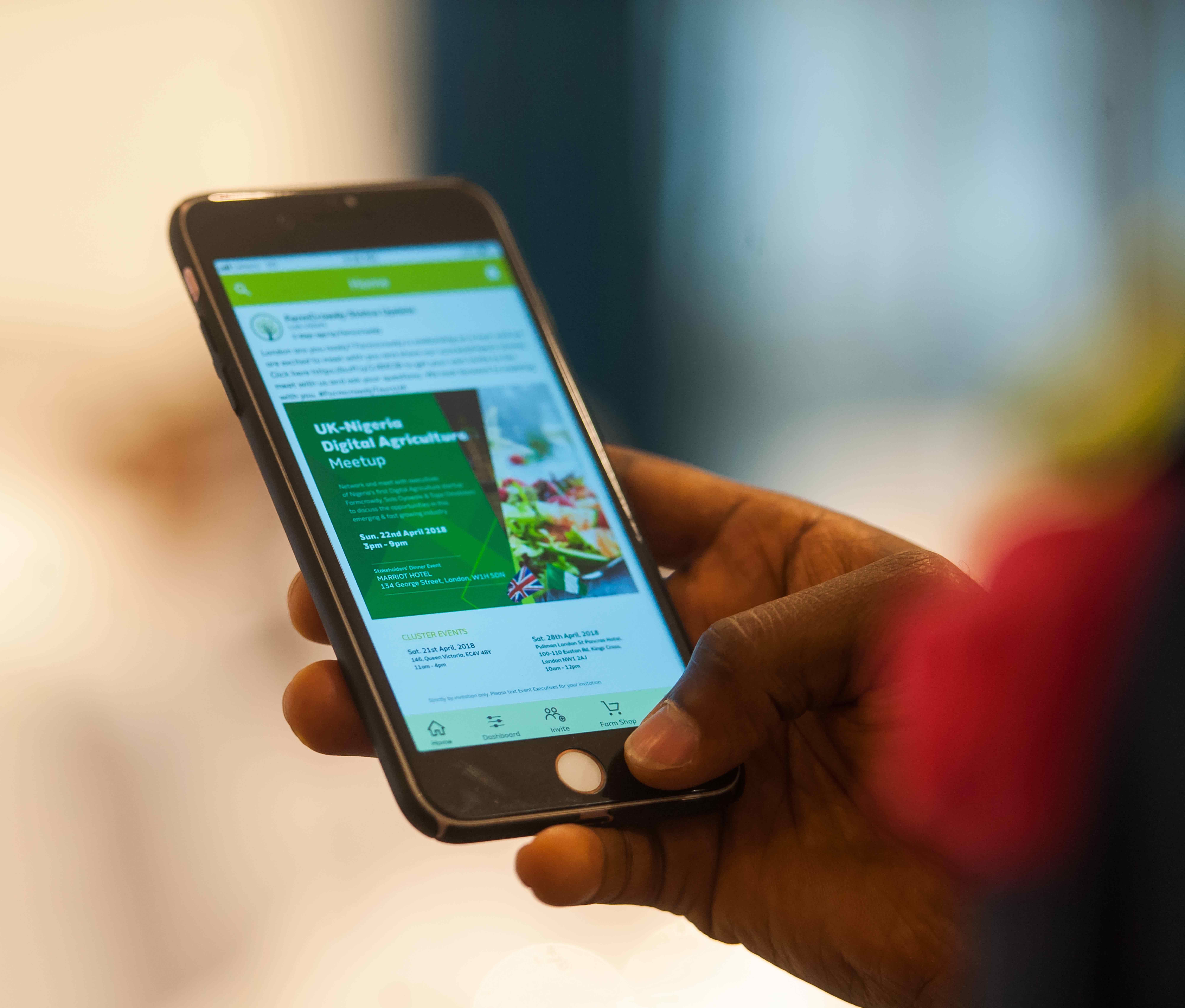 Historic Farmcrowdy product shown on a mobile phone in a promotional photograph