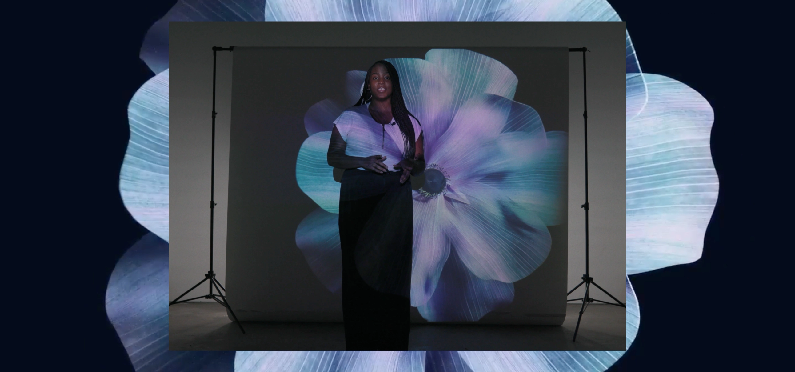 Poet performing in front of screen