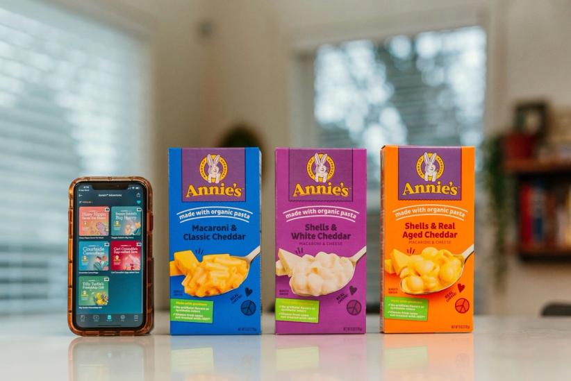 iPhone next to three boxes of mac and cheese