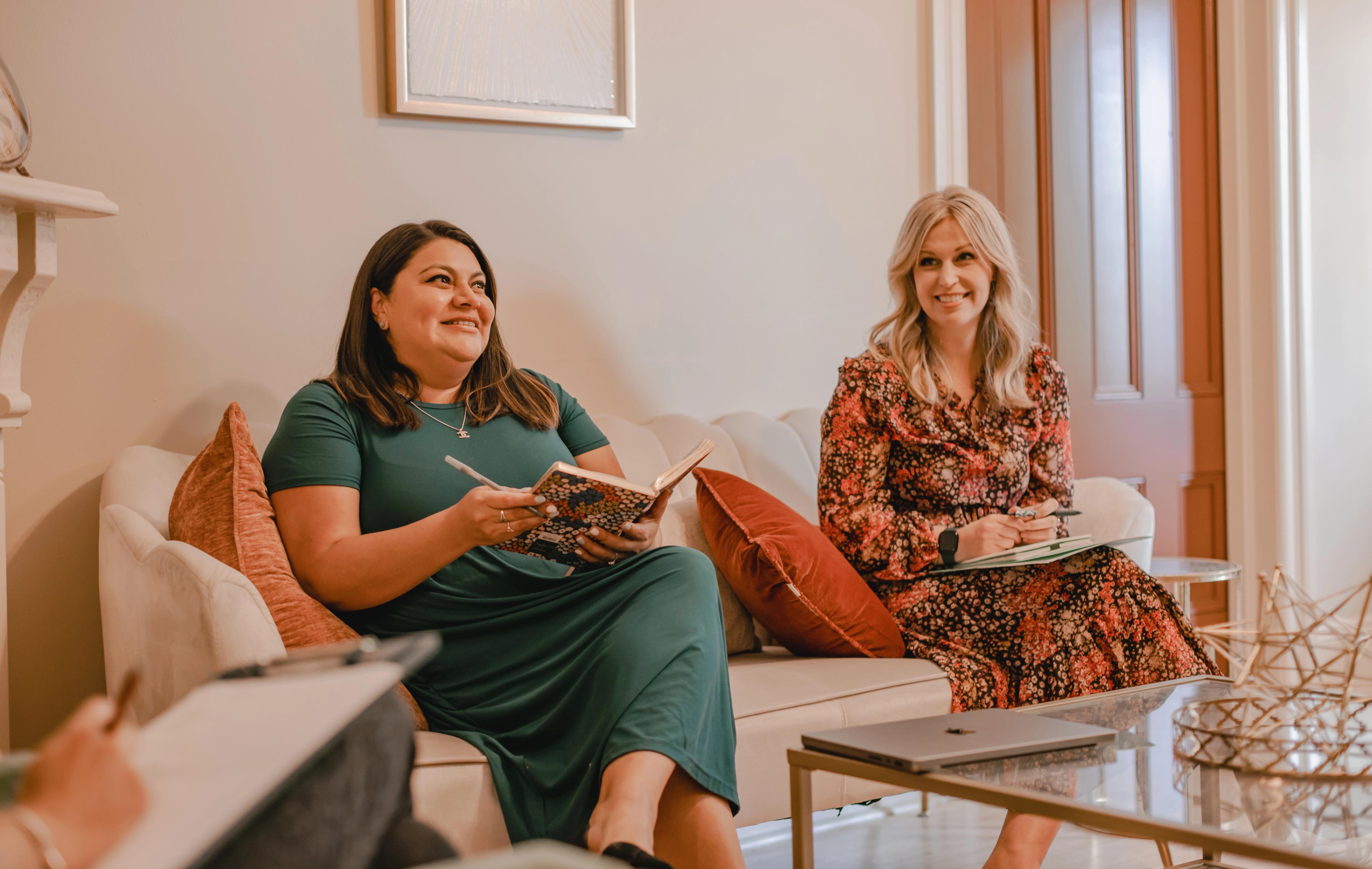 Two people sitting on a couch
