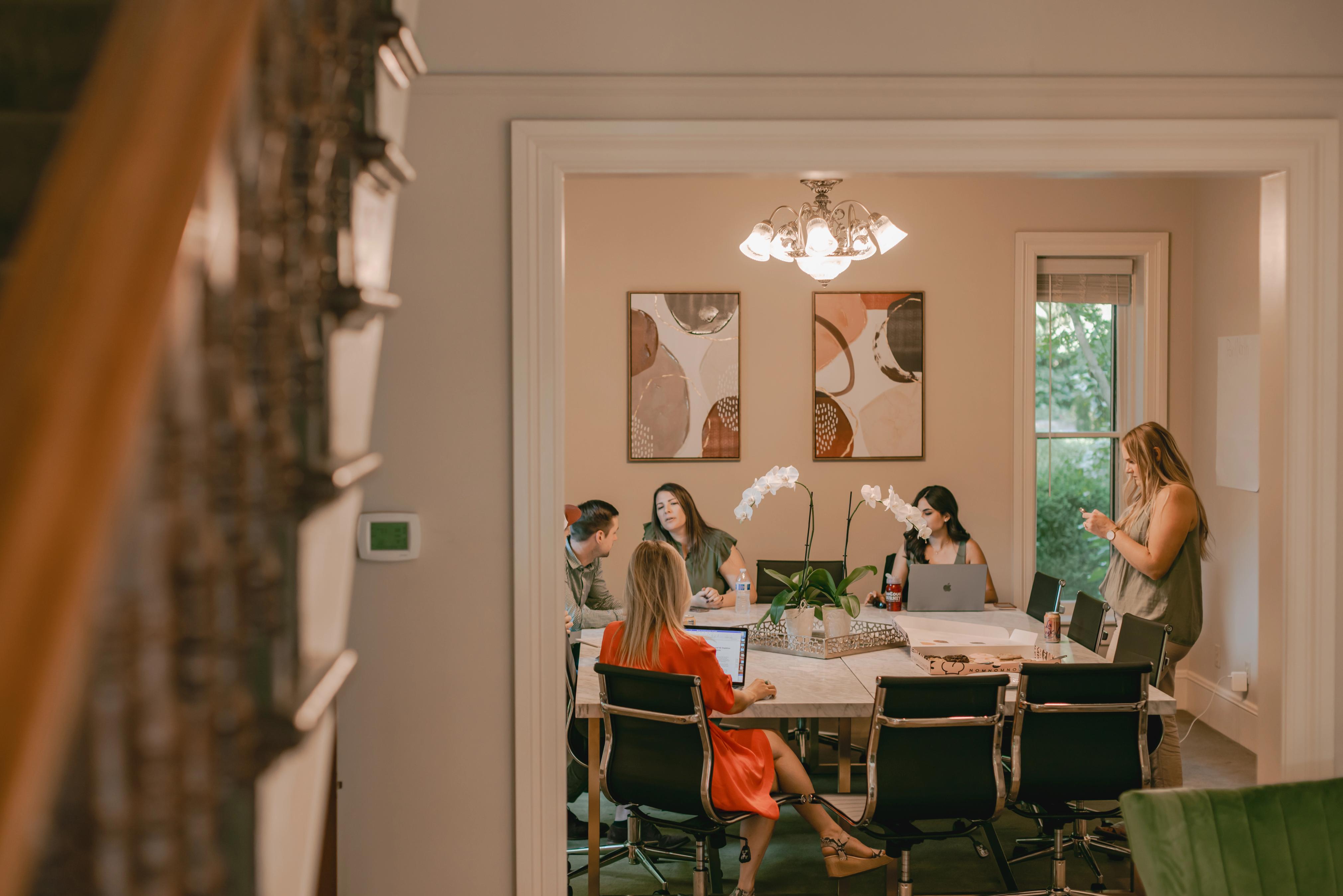 Meeting happening around a kitchen table