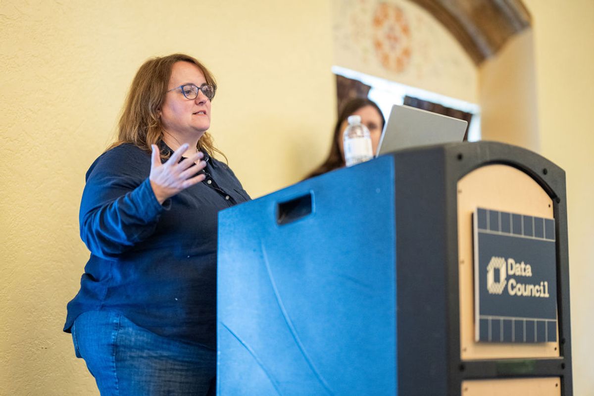Woman speaker at Data Council podium