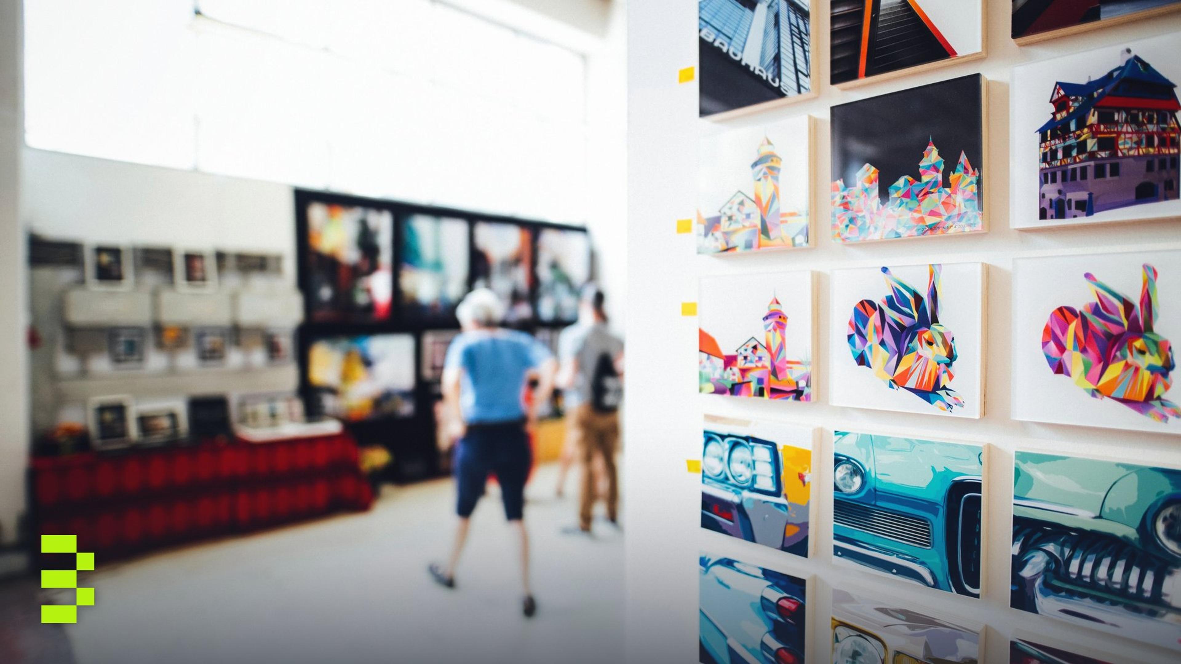Colorful artwork in a modern gallery with people browsing.