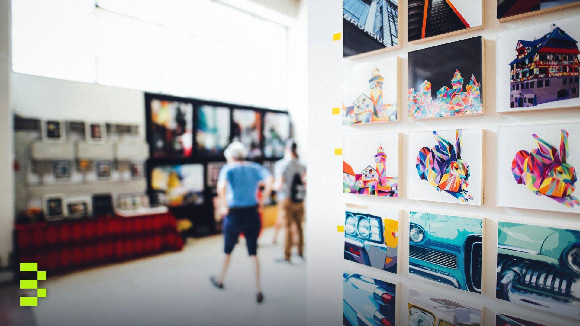Colorful artwork in a modern gallery with people browsing.