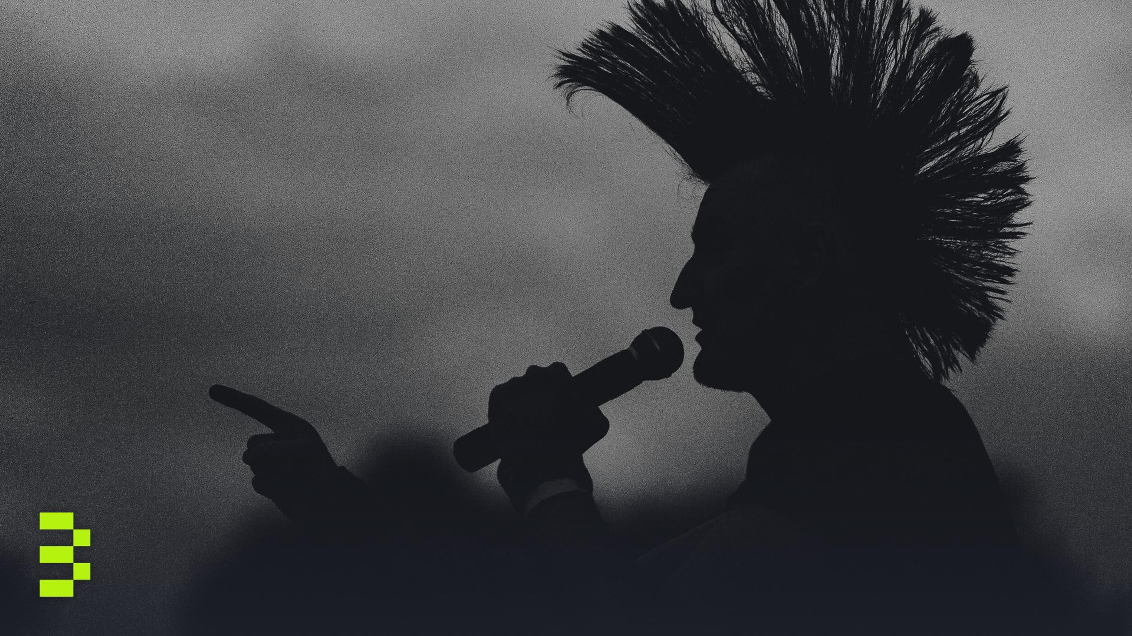 A striking silhouette of a punk singer pointing with a microphone under a dramatic sky.