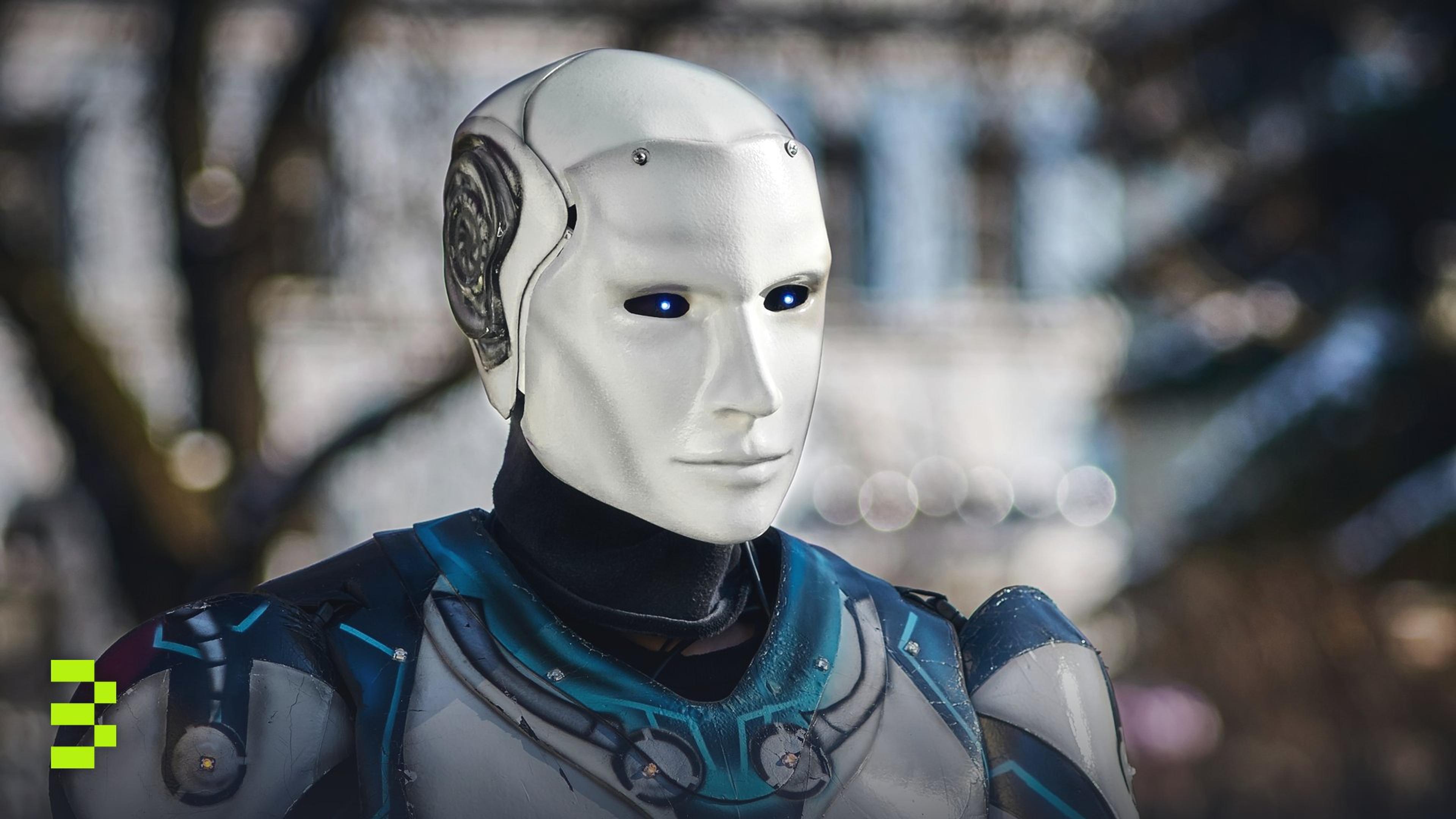 Close-up of a futuristic humanoid robot with metallic armor and blue LED eyes.