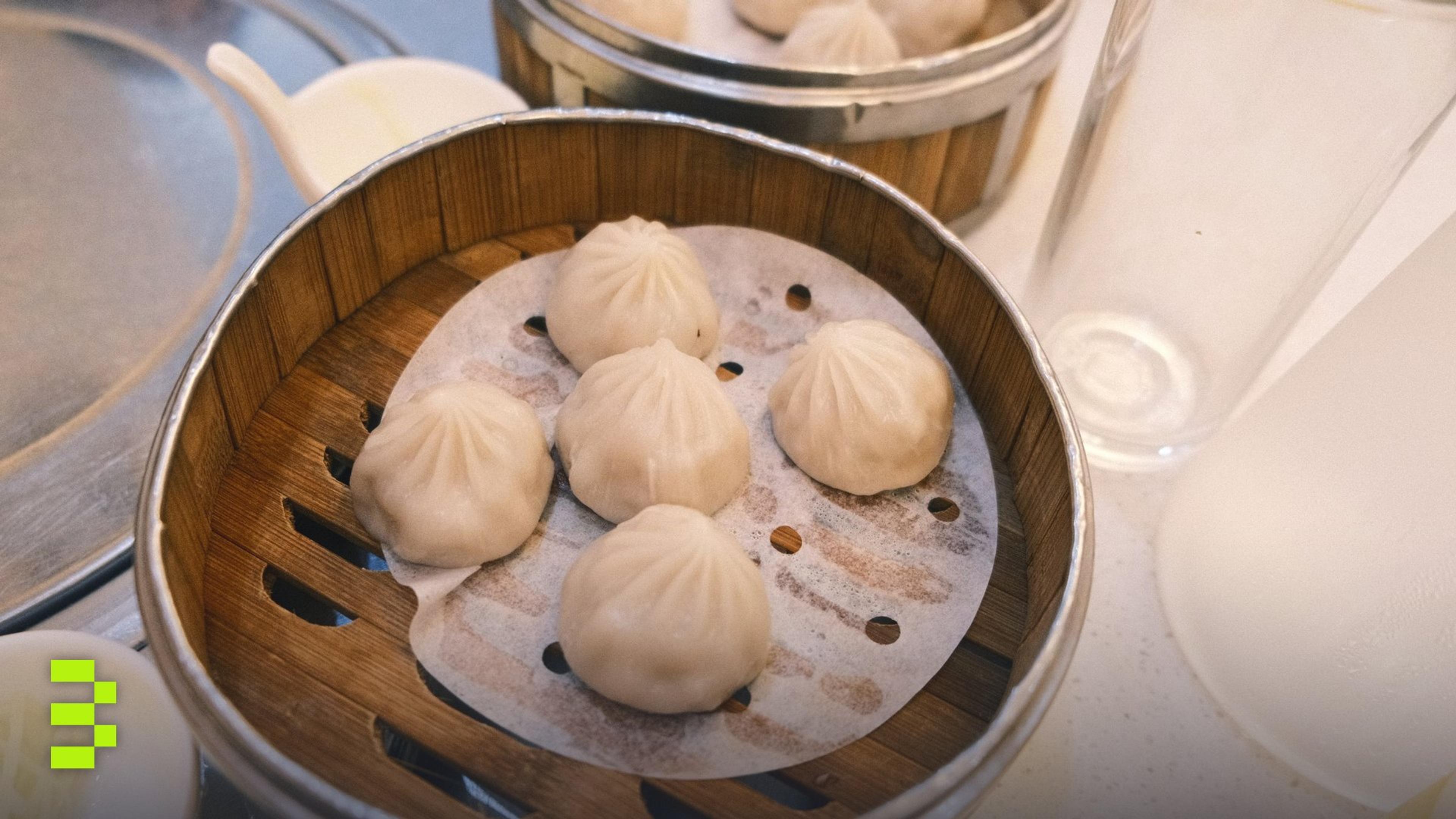 Delicious steamed dumplings served in a traditional bamboo basket.
