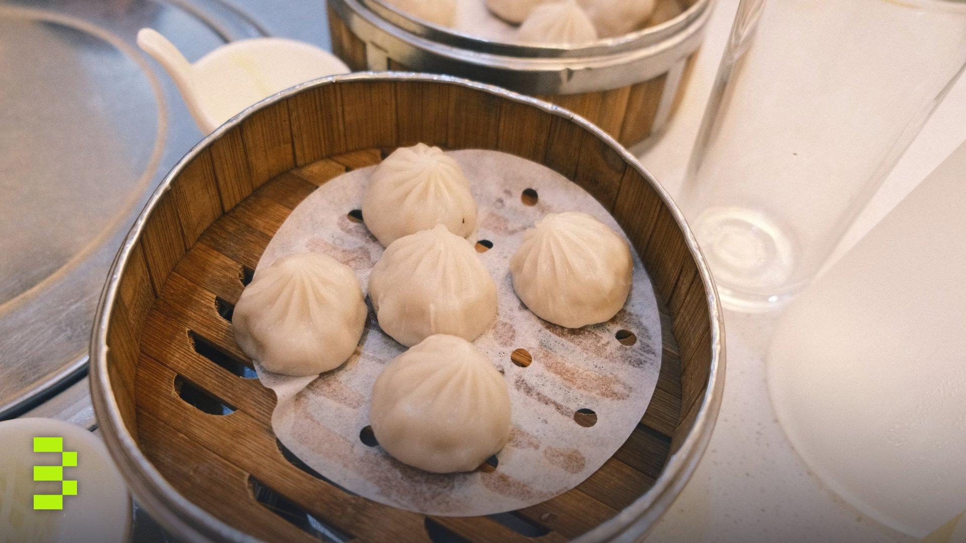 Delicious steamed dumplings served in a traditional bamboo basket.