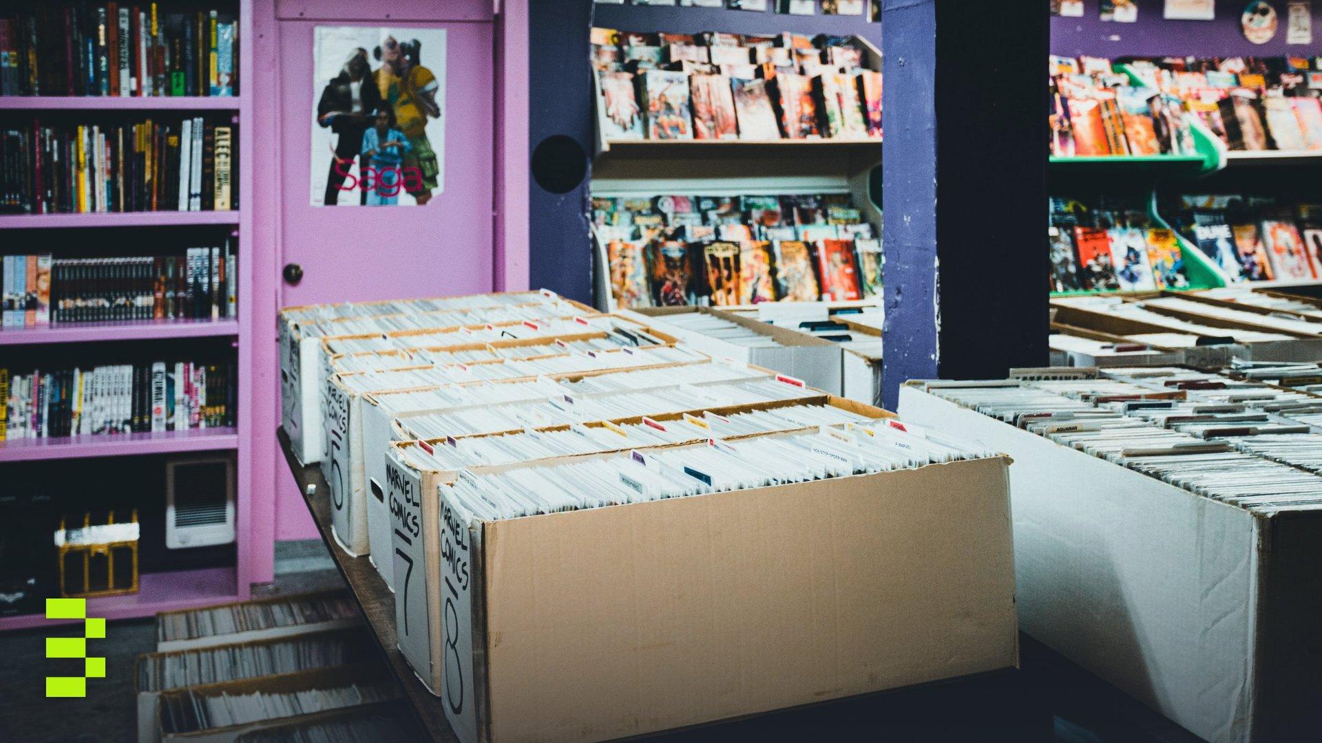 A colorful comic book store with organized shelves and boxes of comics for sale.