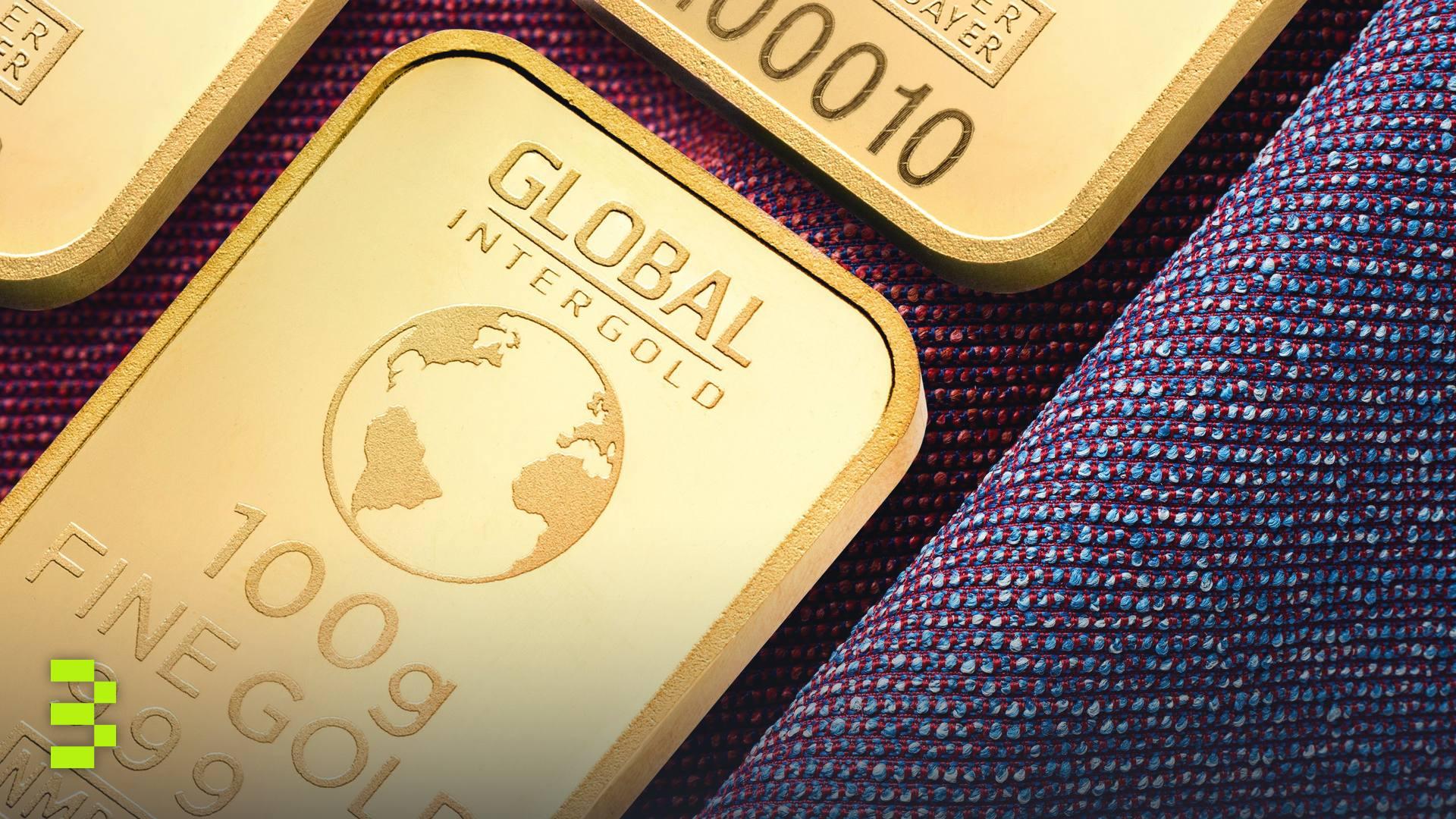 Close-up of stacked gold bullion bars.