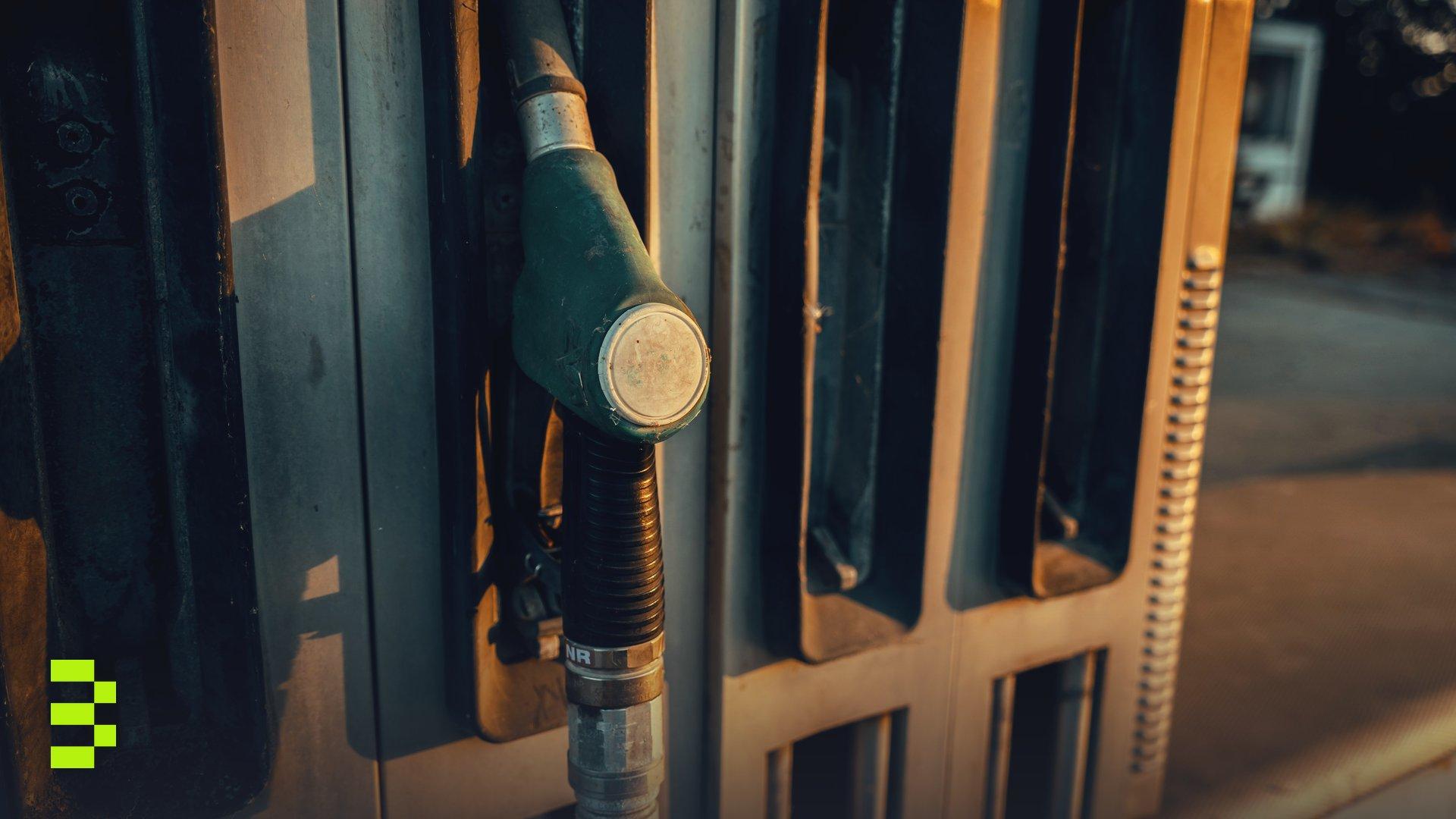 A detailed view of a gas pump nozzle during sunset in Österreich.