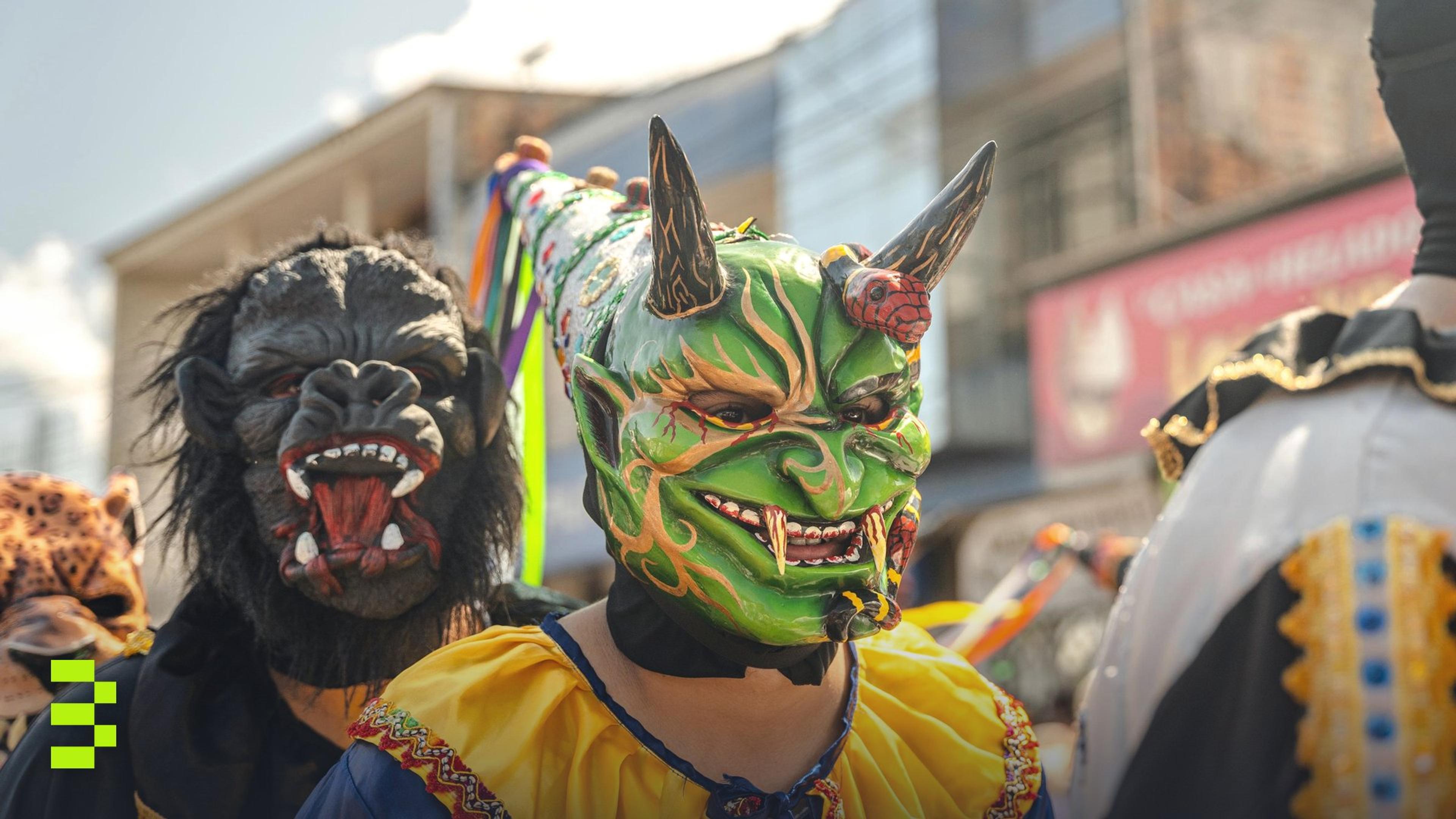 Vibrant costumes and masks at a festive parade in Rioja, Peru.