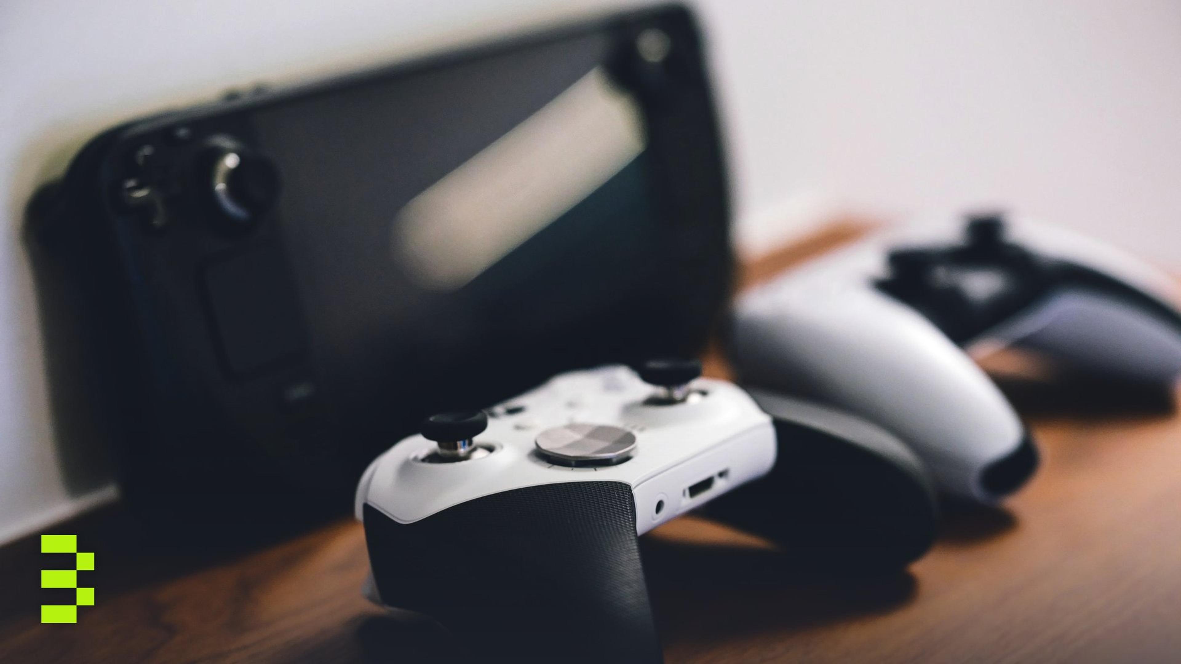 Stylish setup of gaming controllers and console on wooden surface.