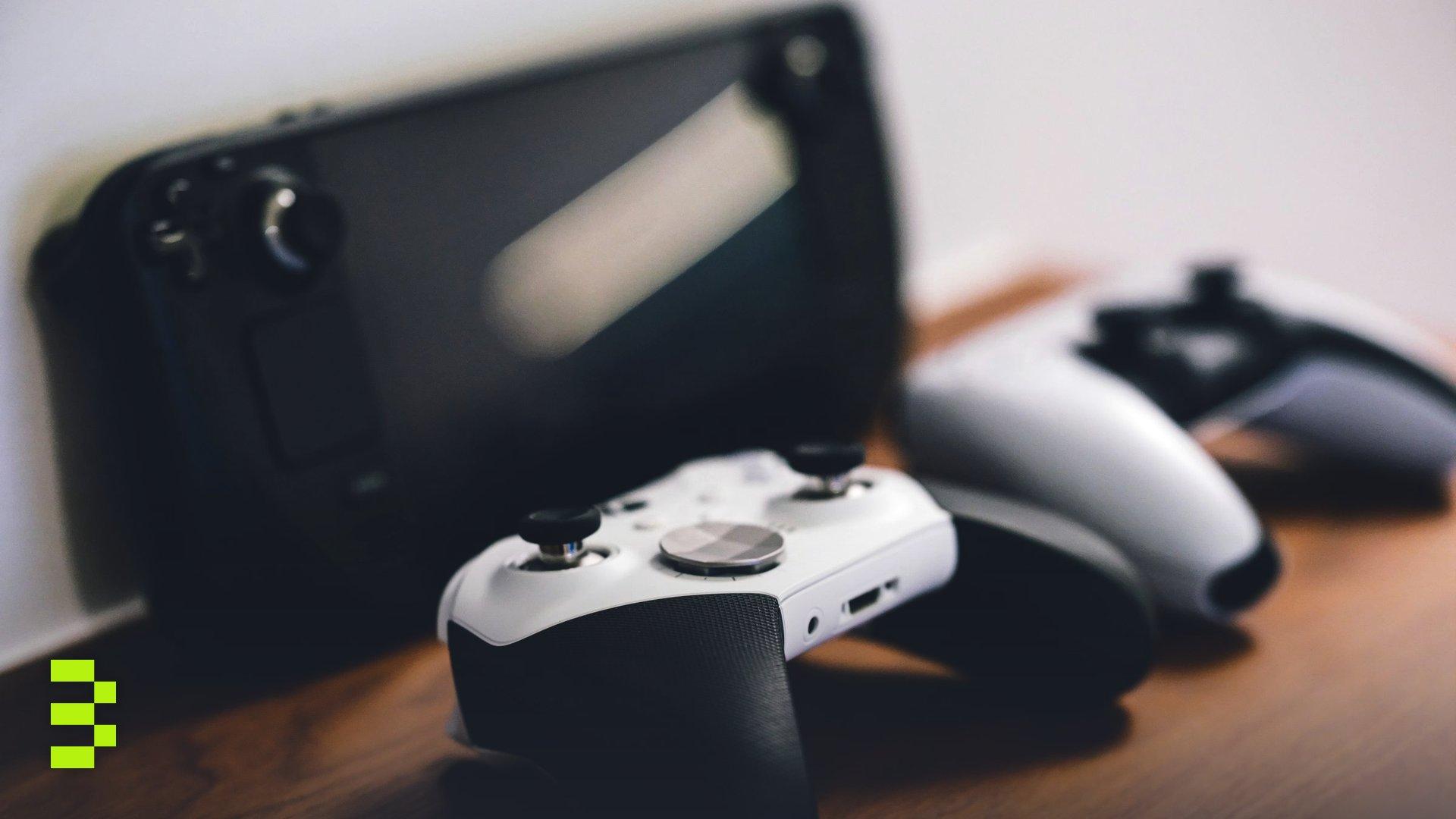 Stylish setup of gaming controllers and console on wooden surface.