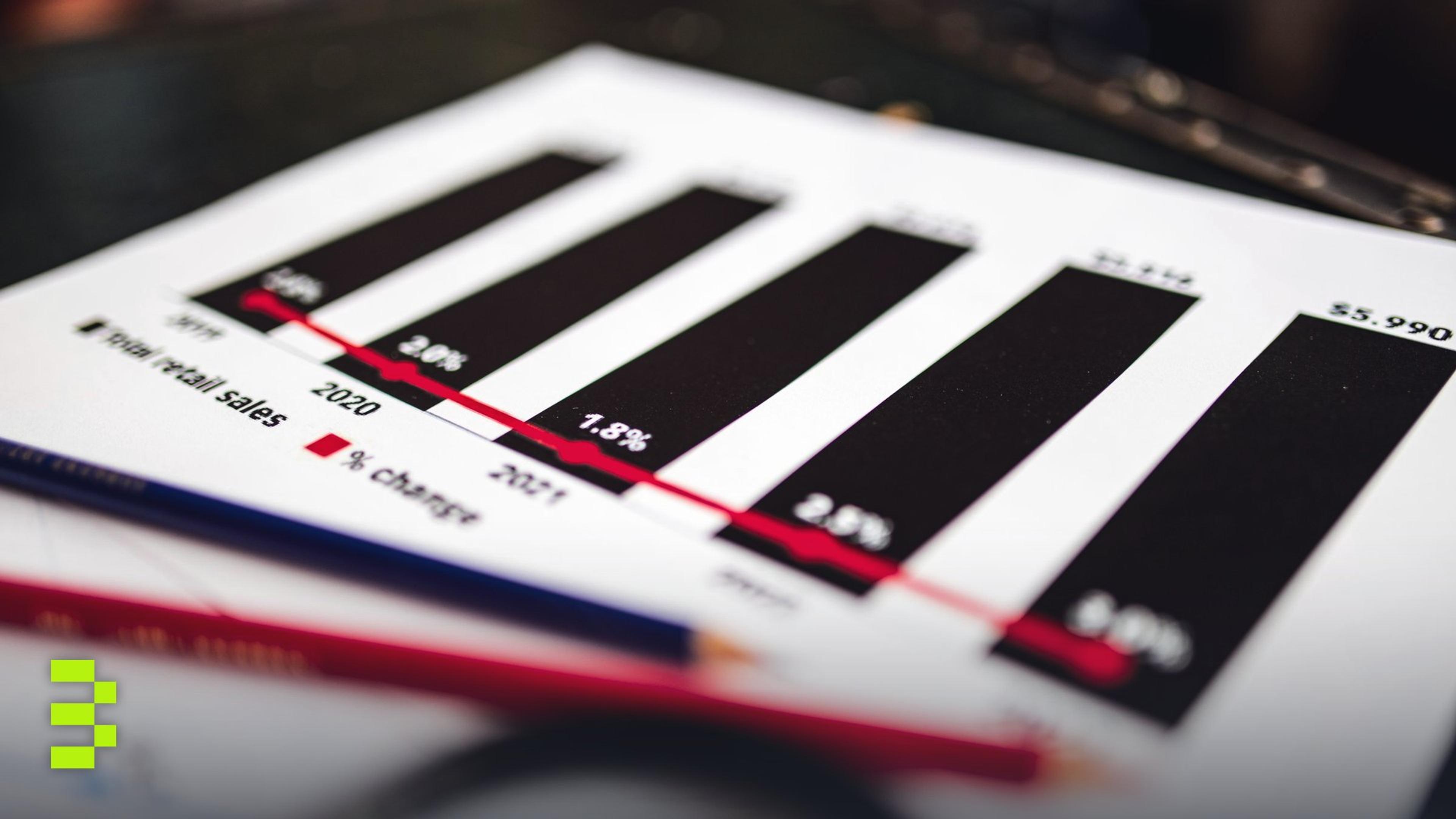 Close-up of a financial report showing sales data with dramatic depth of field.