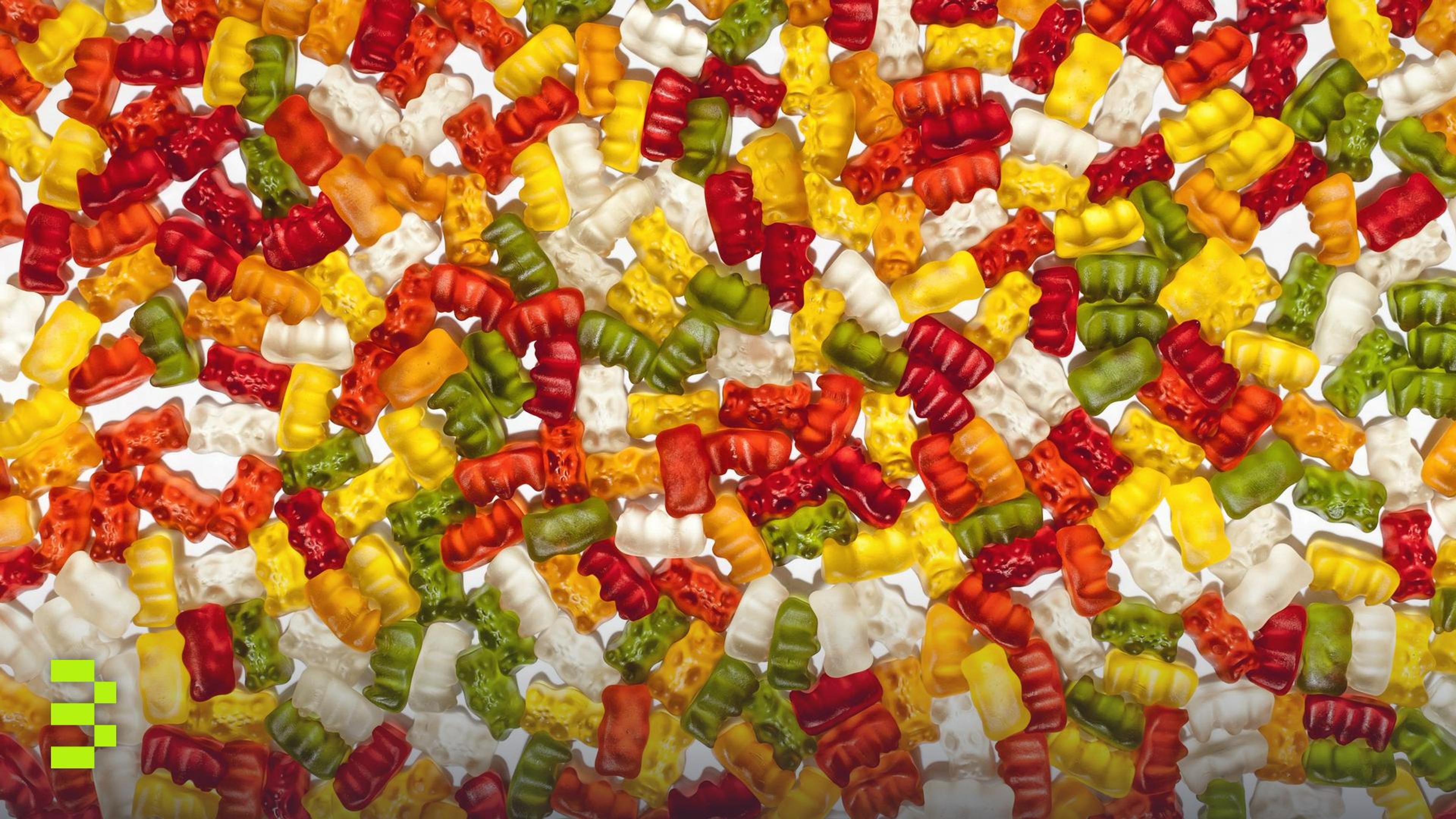Brightly colored gummy bears in abstract arrangement.