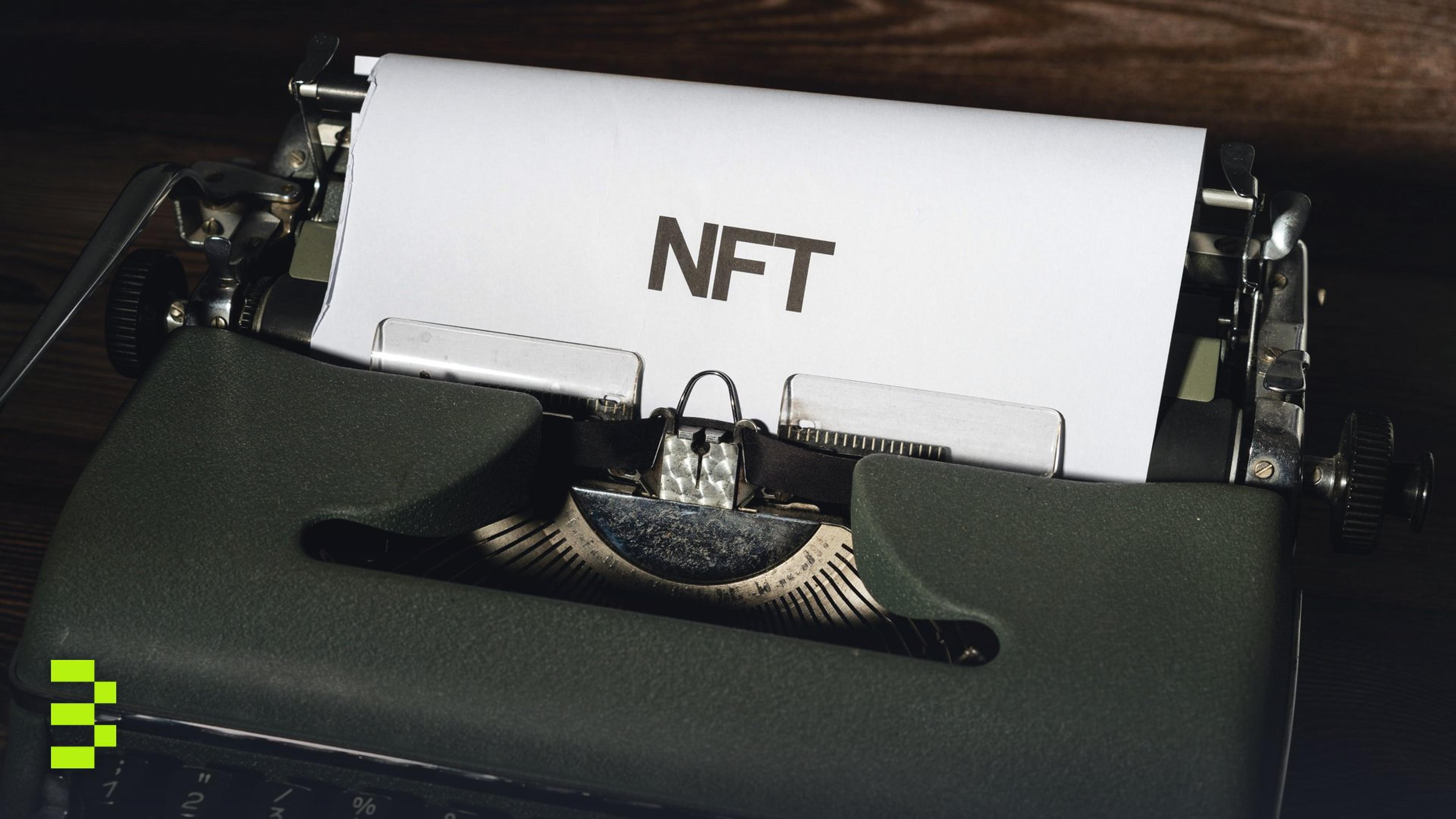 Close-up of a vintage typewriter with the word 'NFT' typed on paper.