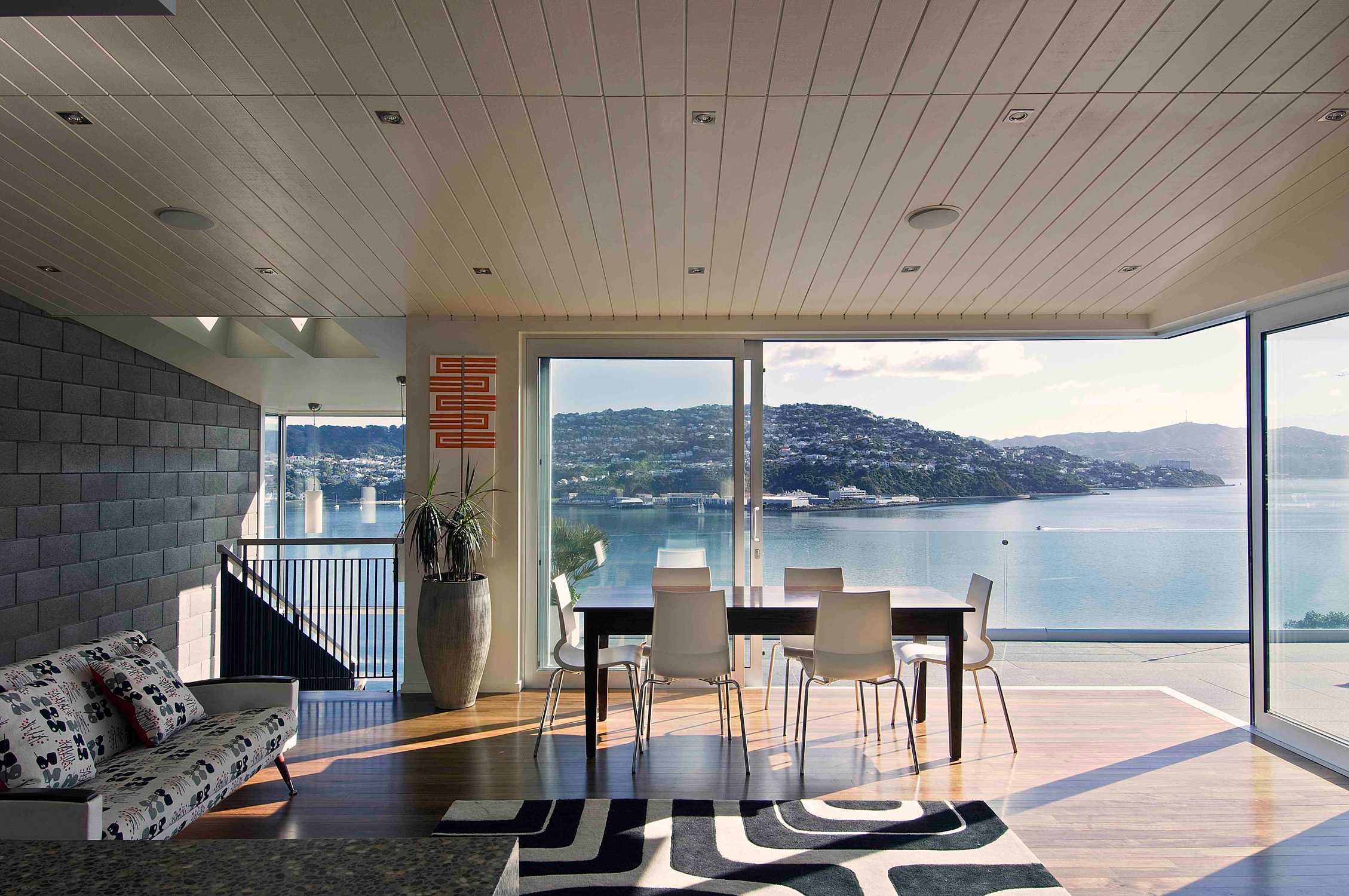 Hillside home Wellington New Zealand architecture award architect contemporary forms natural landscape