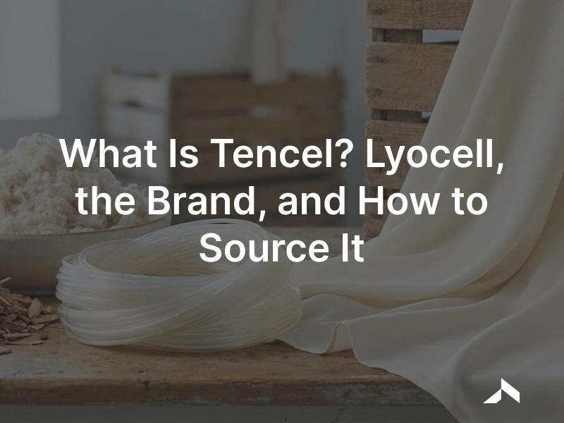 Soft draping Tencel lyocell fabric in a cream tone beside eucalyptus wood pulp, showing the wood-to-fibre cellulosic textile