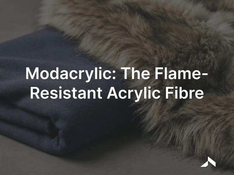 Soft flame-resistant knit fabric and faux-fur pile in neutral tones on a textile studio surface