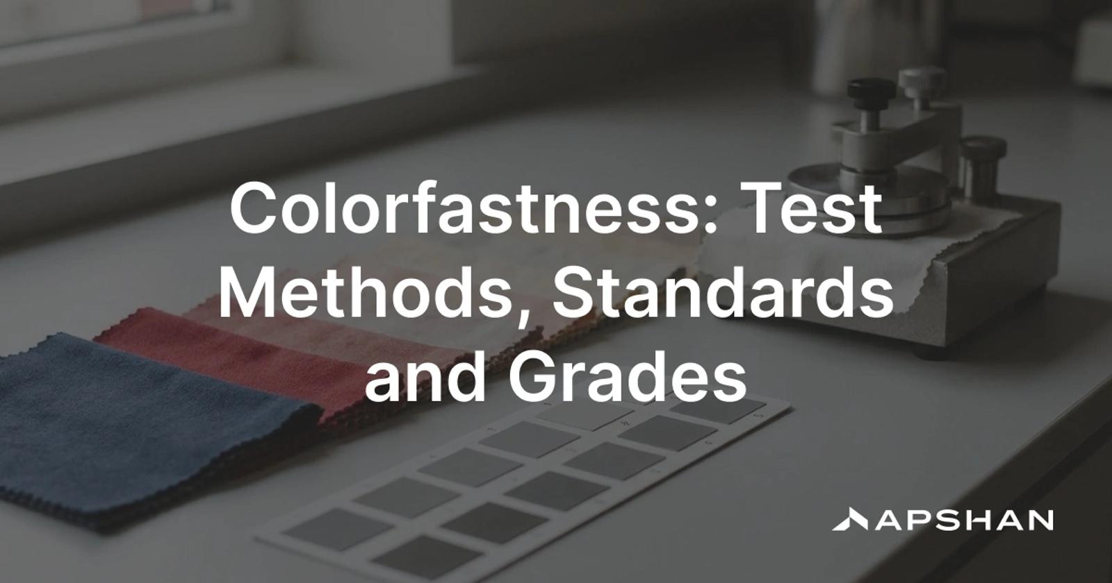 Colorfastness testing: a dyed fabric swatch beside a grey scale rating card and a crockmeter for testing color rubbing