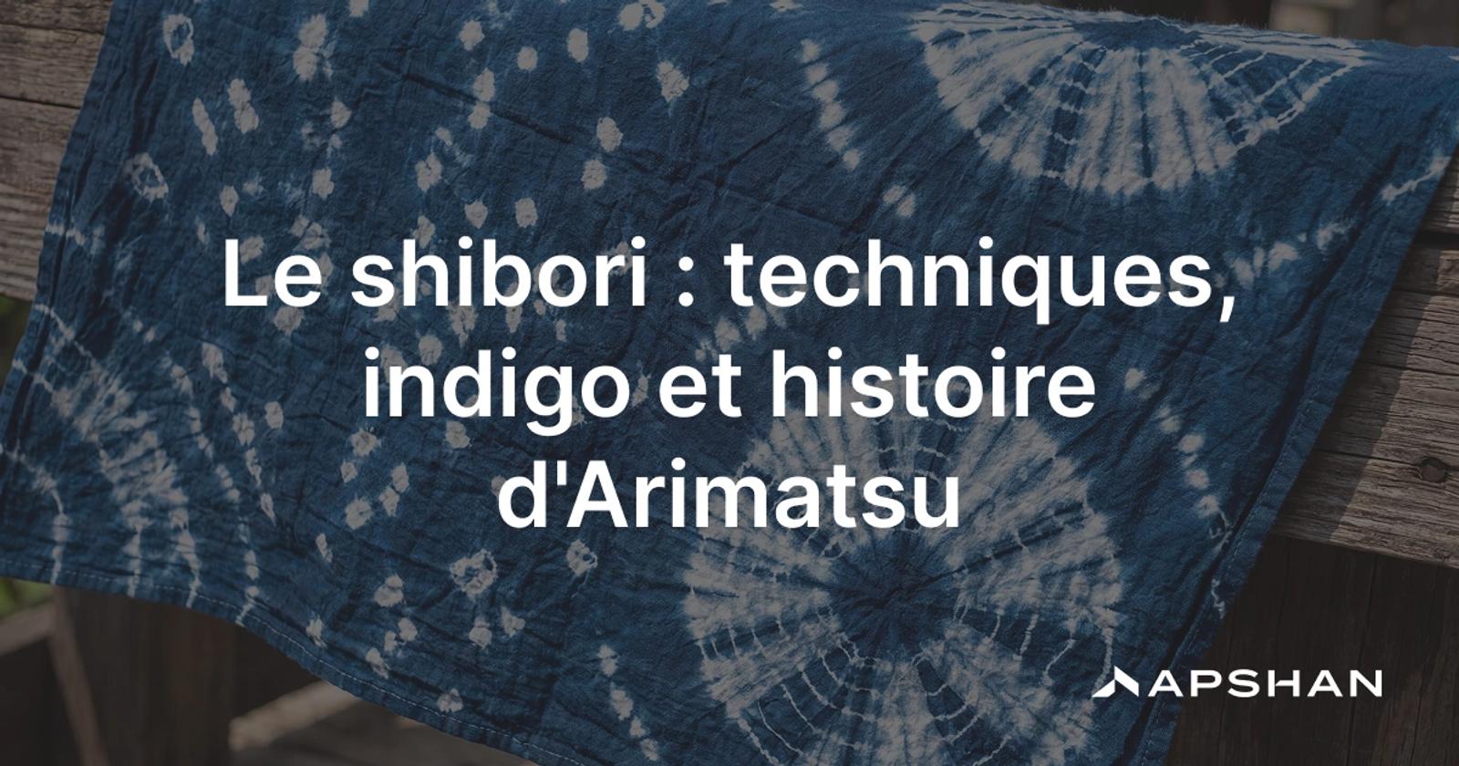 Tissu de shibori en indigo sur coton, motif moucheté blanc obtenu par nouage à réserve.