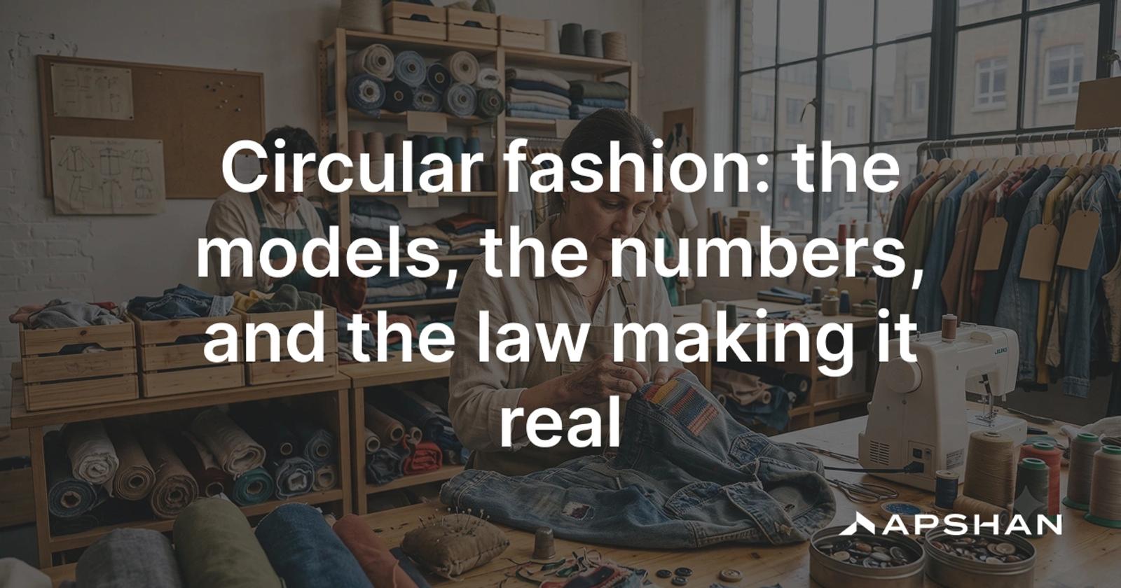 A woman hand-sewing patches onto a denim jacket in a busy upcycling workshop.