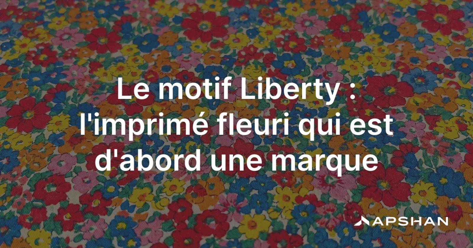 Gros plan sur un tissu Liberty en Tana Lawn, couvert de minuscules fleurs serrées et colorées.