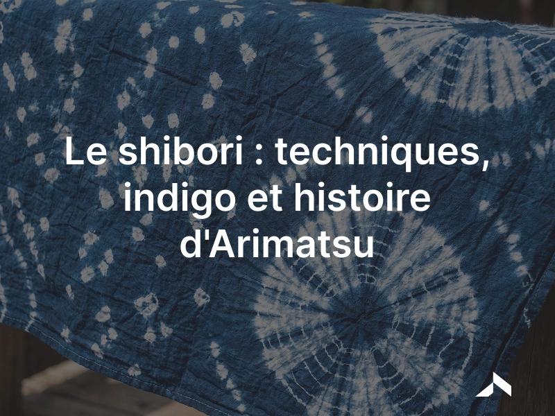 Tissu de shibori en indigo sur coton, motif moucheté blanc obtenu par nouage à réserve.