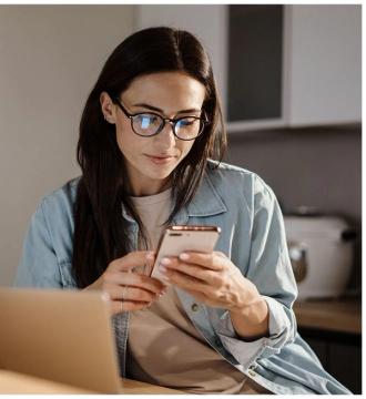 woman looking at her mobile phone