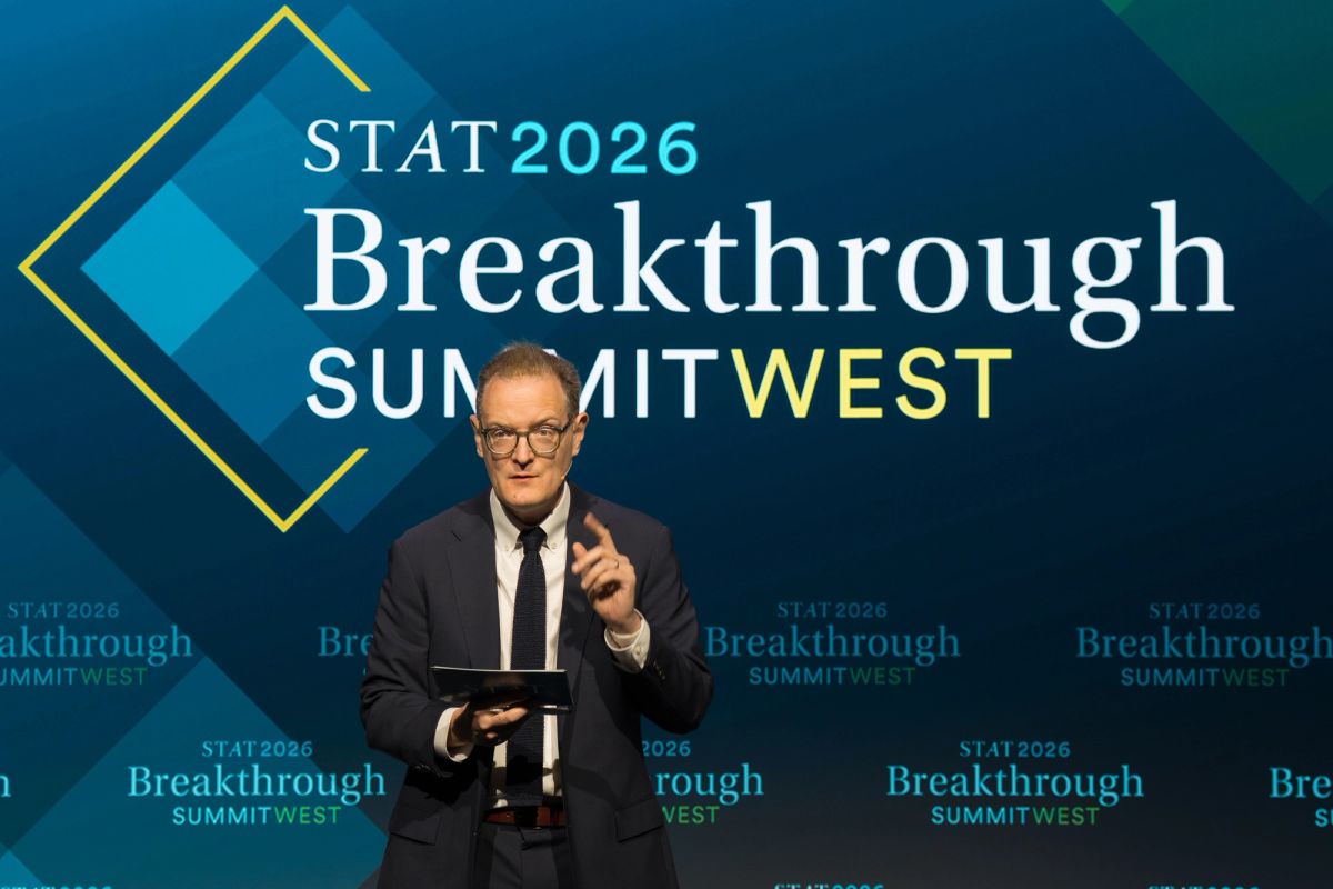 Speaker at podium presenting at STAT 2026 Breakthrough Summit West conference