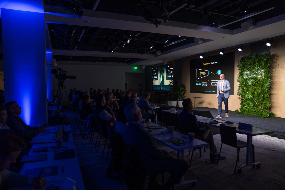 Wide angle of stage and audience during a Conference at Convene SF