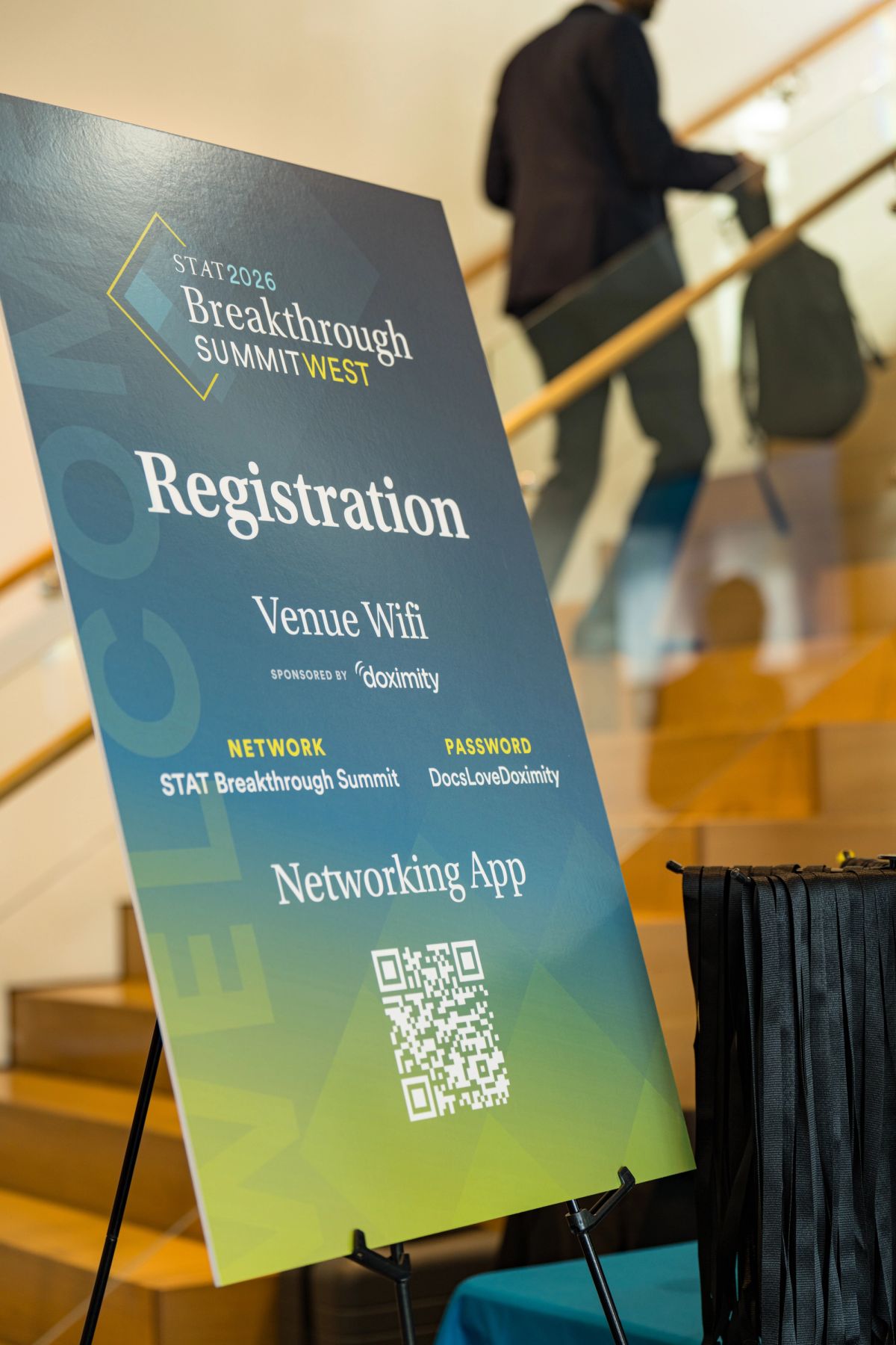 Registration sign for STAT 2026 Breakthrough Summit West displaying venue wifi and networking app details.